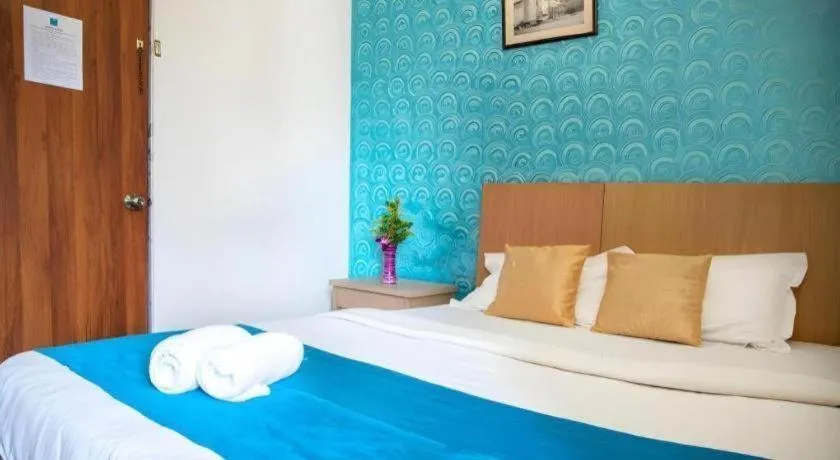 Bed in Palm Air by Goa Signature Stays