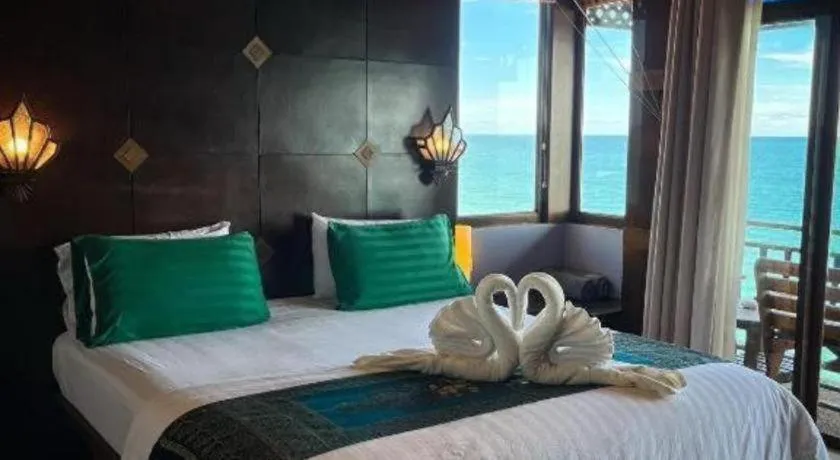 Bed in Diamond Cliff Beach Lanta Resort