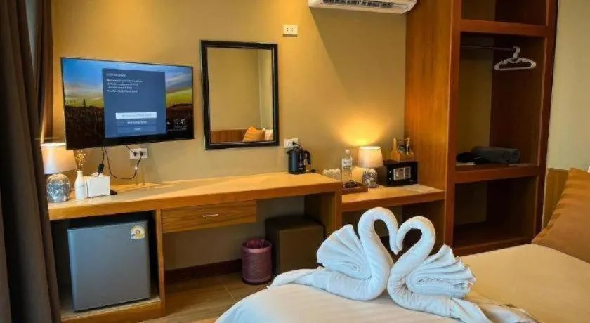 Bed in Diamond Cliff Beach Lanta Resort