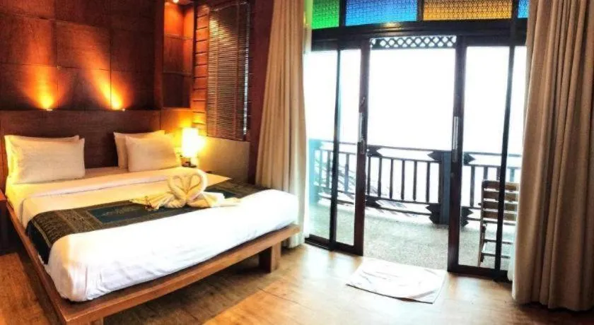 Bed in Diamond Cliff Beach Lanta Resort