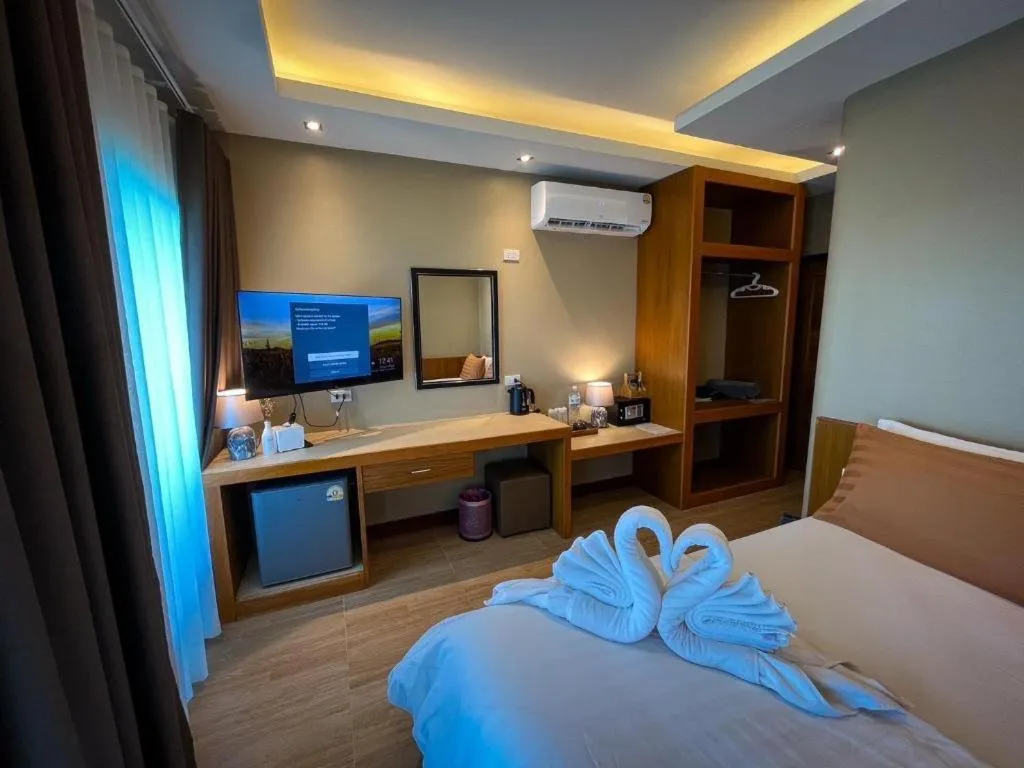 Bed in Diamond Cliff Beach Lanta Resort