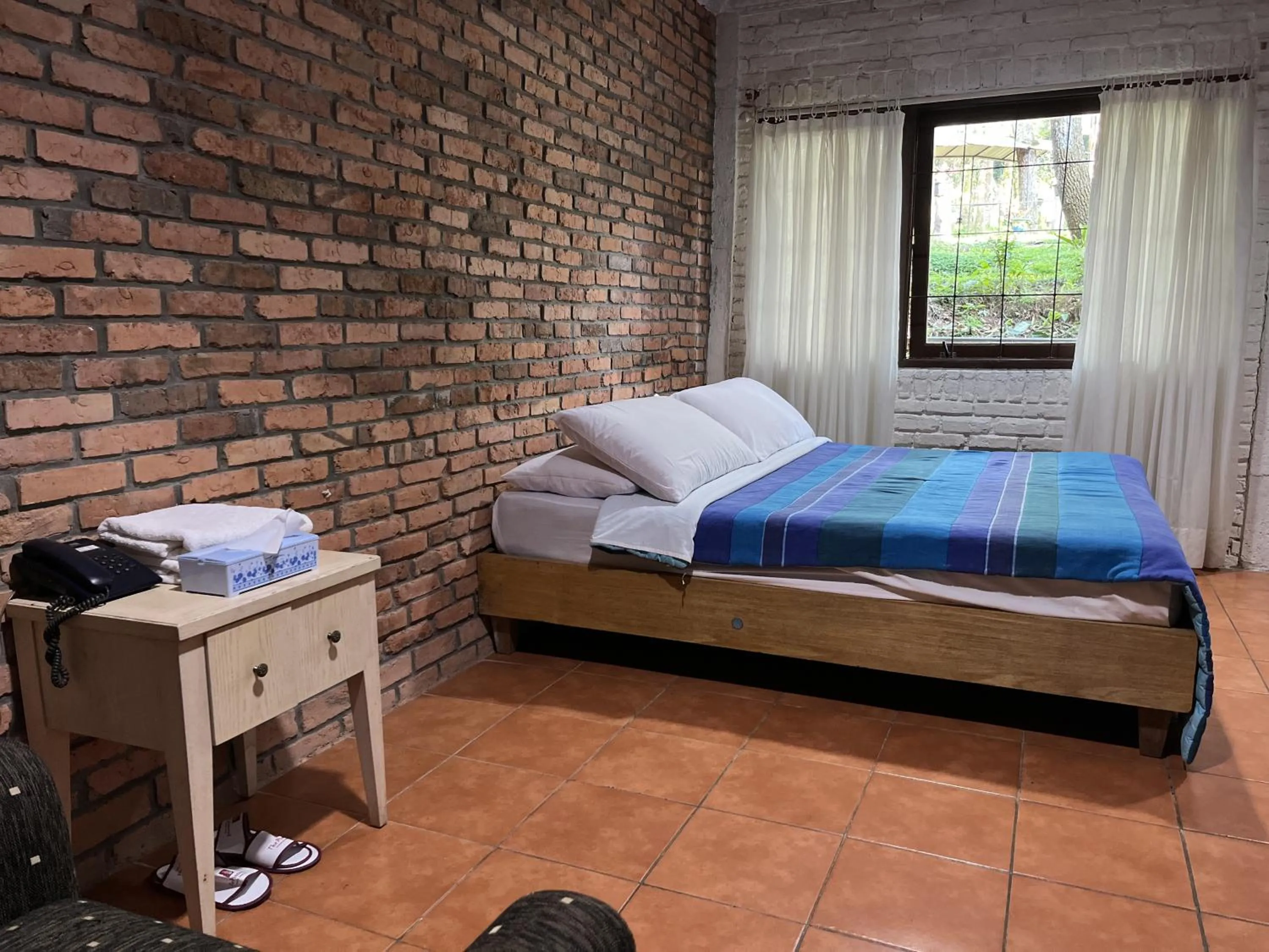 Bed in The Pinewood Lodge and Organic Farm