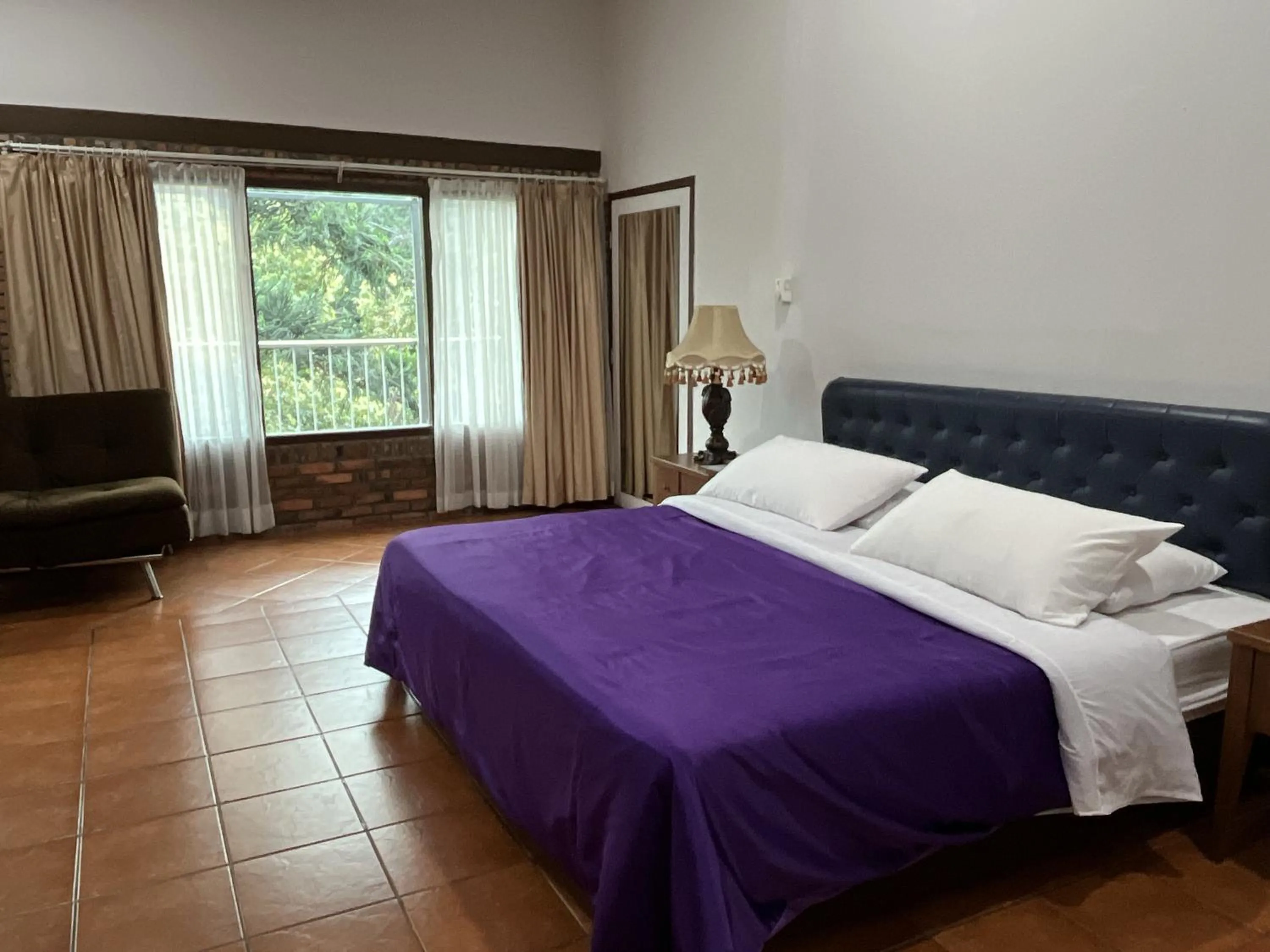 Bed in The Pinewood Lodge and Organic Farm