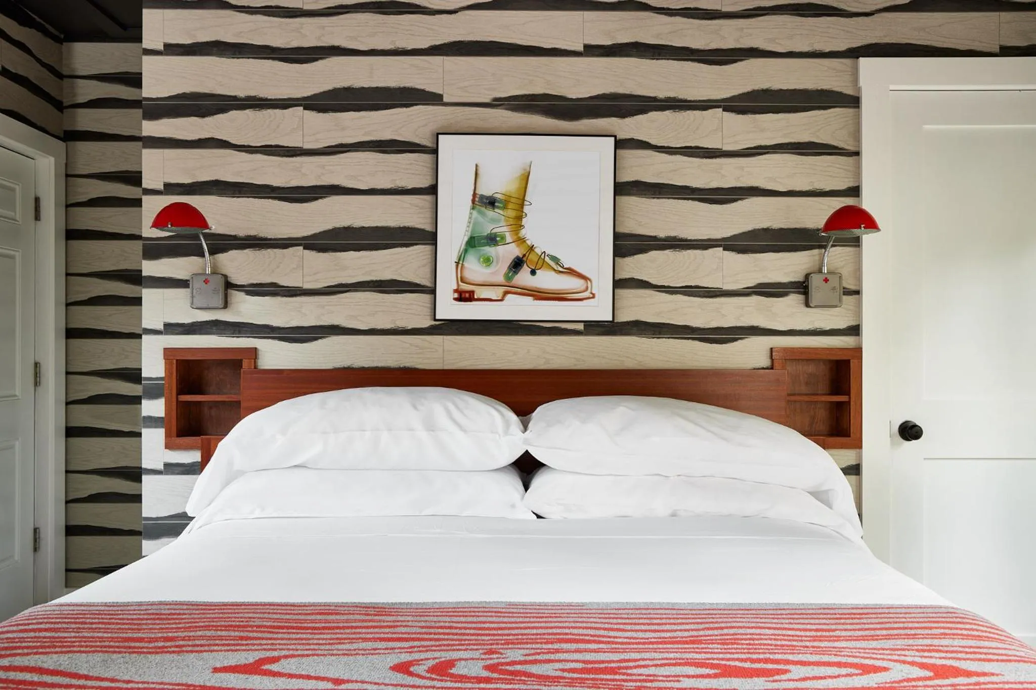 Bed in Field Guide Lodge