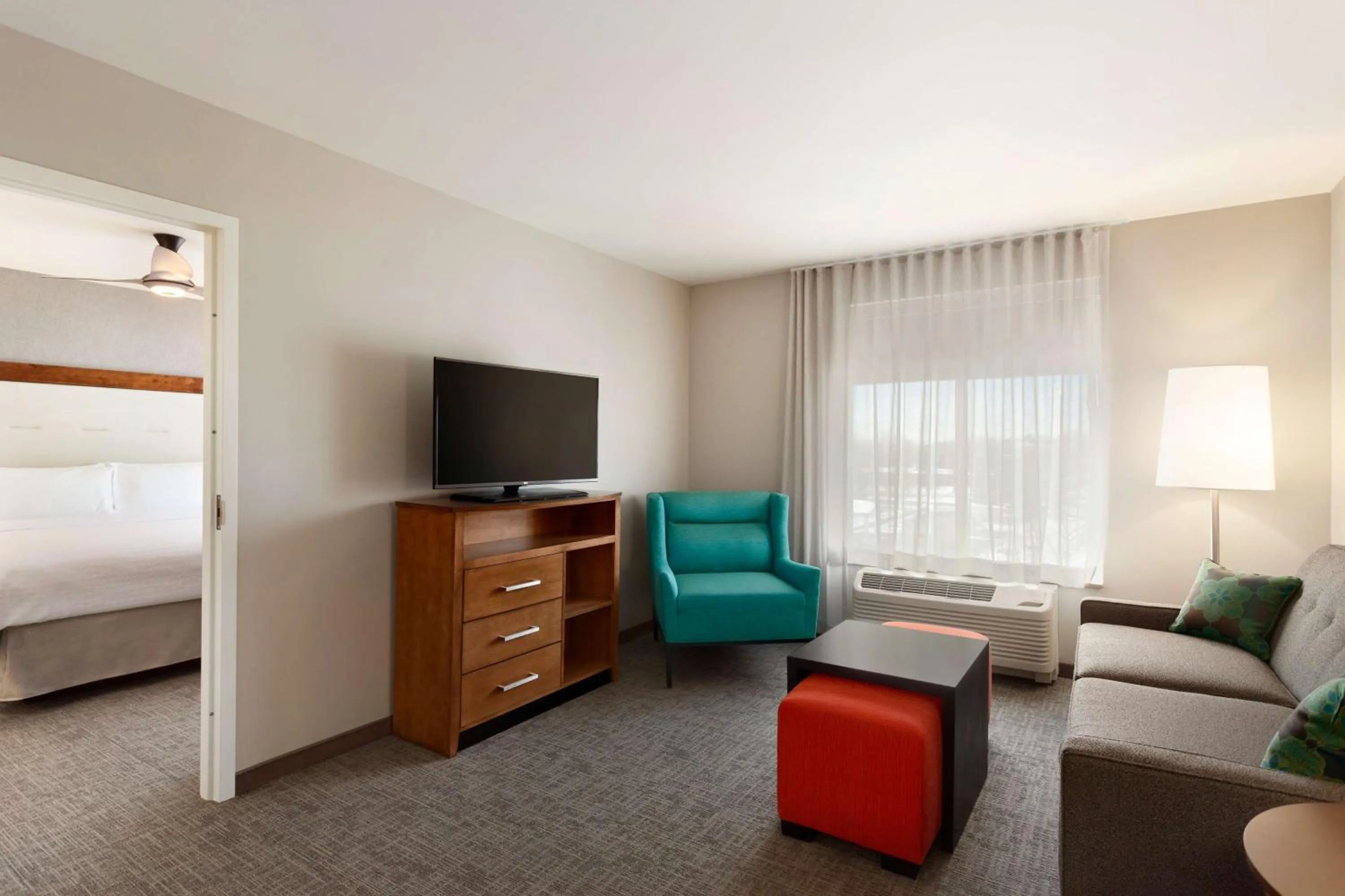 Living room, Bed in Homewood Suites by Hilton Syracuse - Carrier Circle