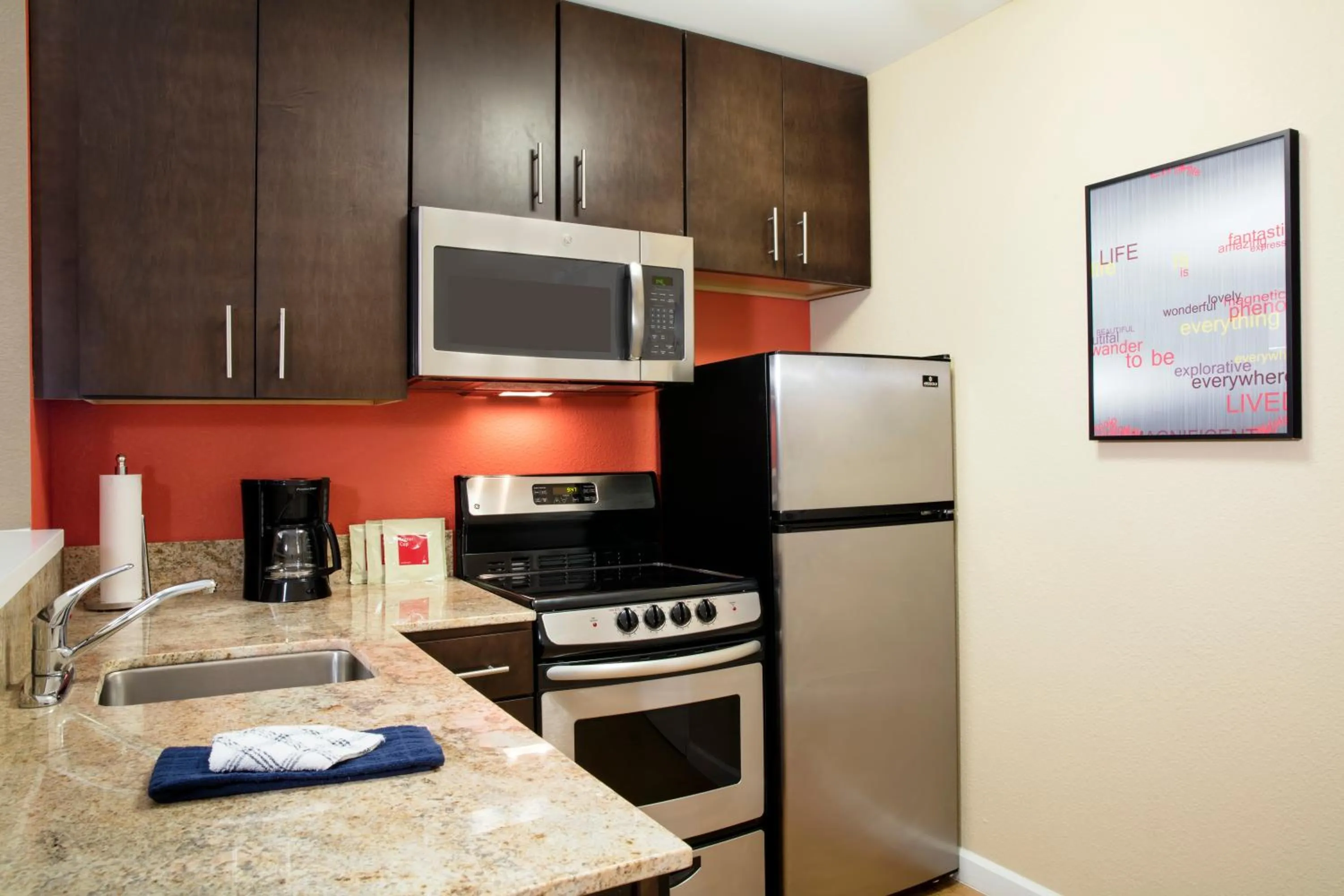 kitchen in TownePlace Suites Orlando at FLAMINGO CROSSINGS Town Center, Western Entrance
