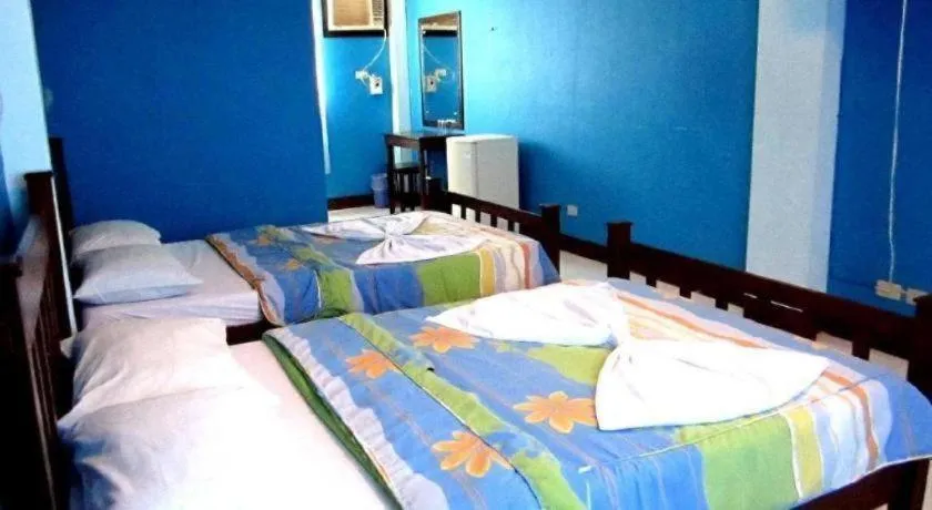 Bed in Tamaraw Beach Resort