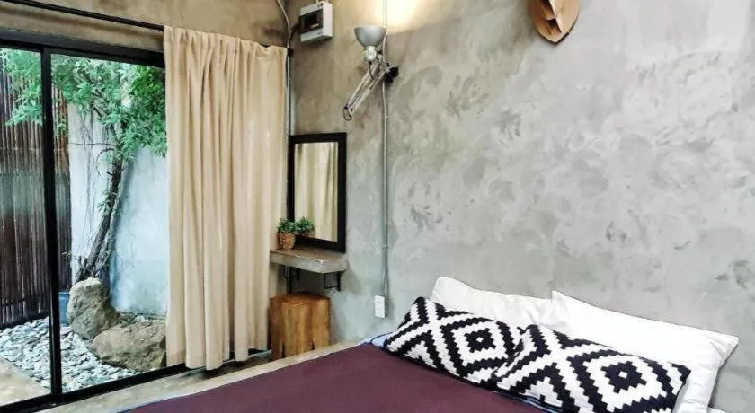 Bed in PAUSE Resort & Bar