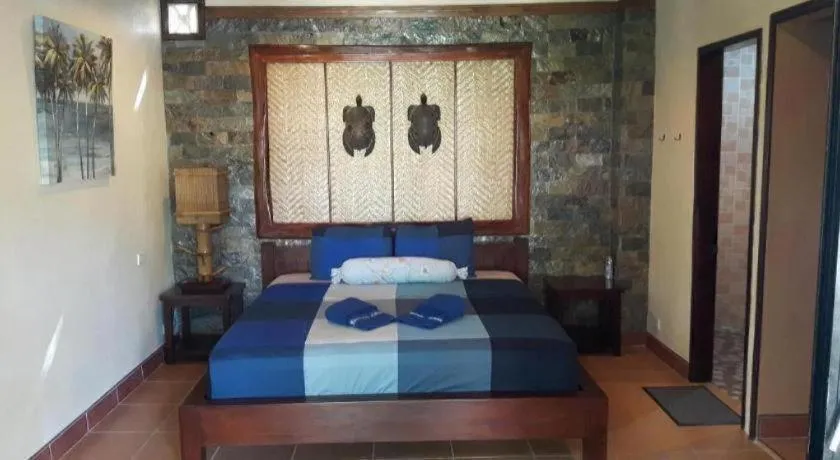 Bed in Treasure Island Beach Bungalows