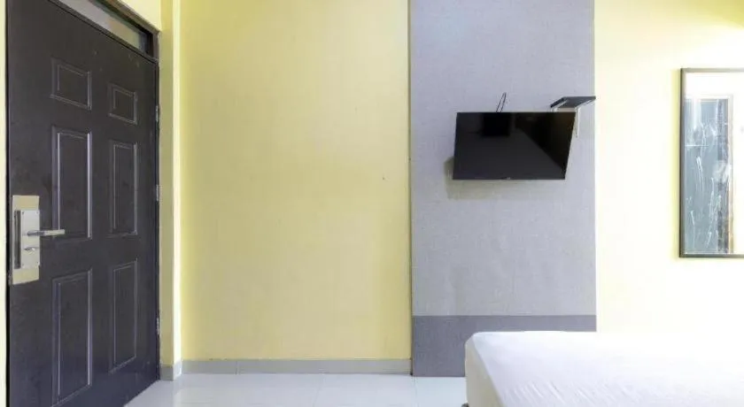 Bed in Urbanview Hotel Delima 101 Syariah