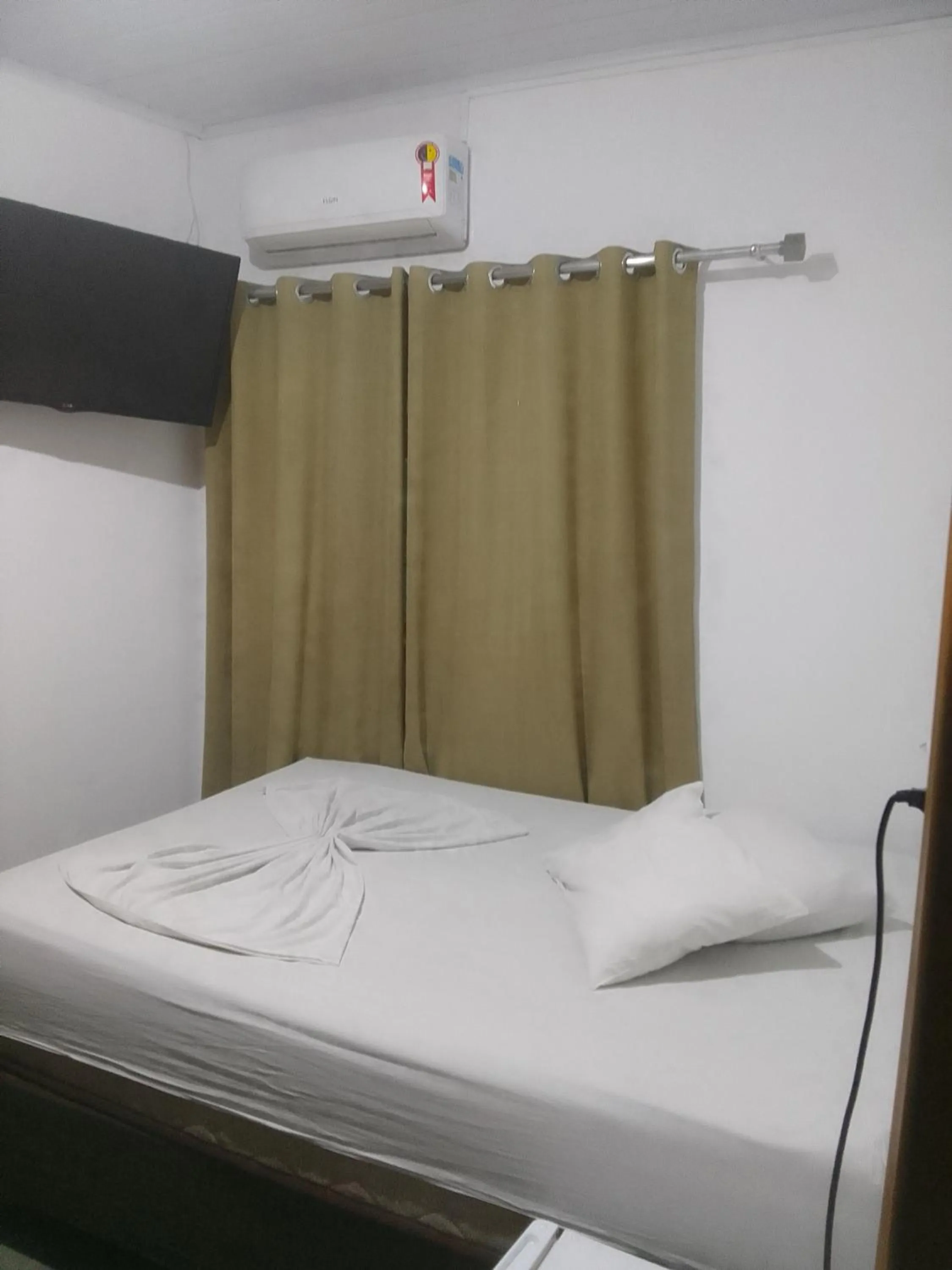 Bed in Pousada Santa Terezinha