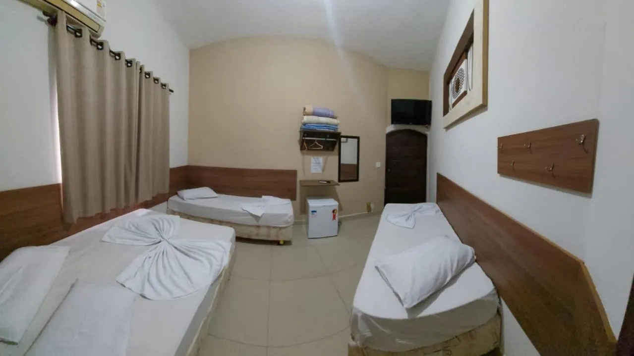 Bed in Pousada Santa Terezinha