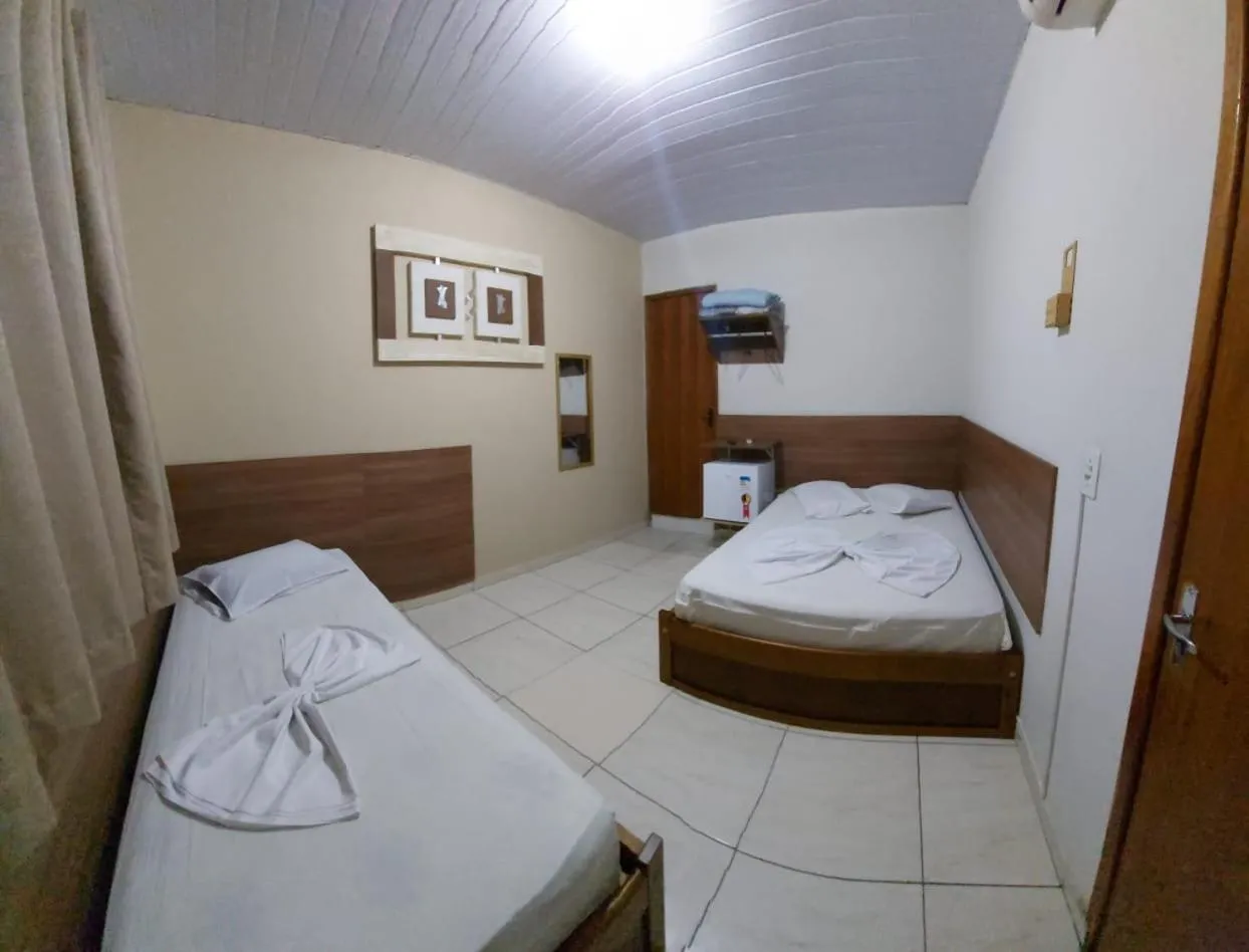 Bed in Pousada Santa Terezinha