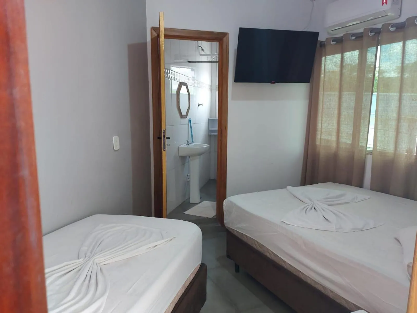 Bed in Pousada Santa Terezinha