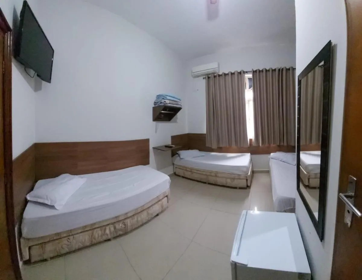 Bed in Pousada Santa Terezinha