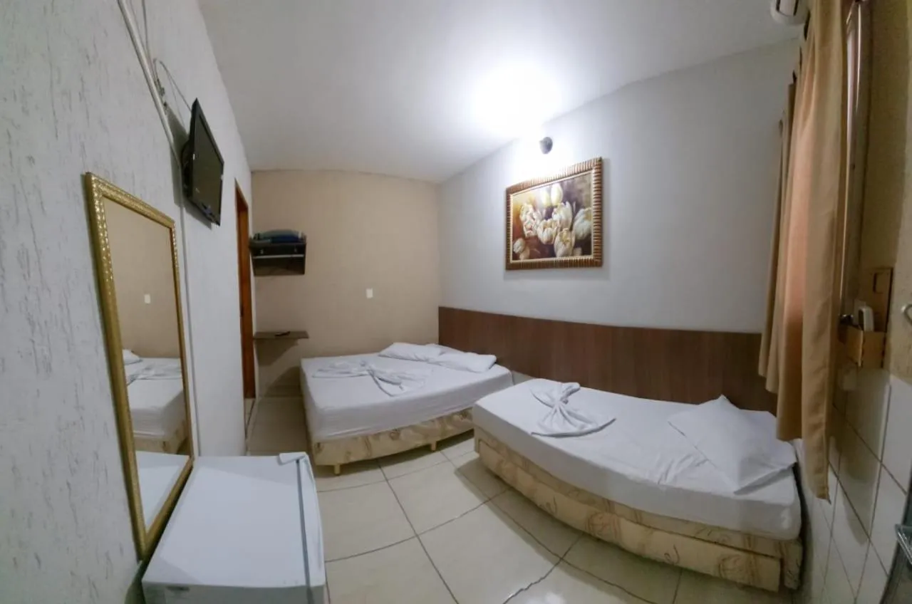 Bed in Pousada Santa Terezinha