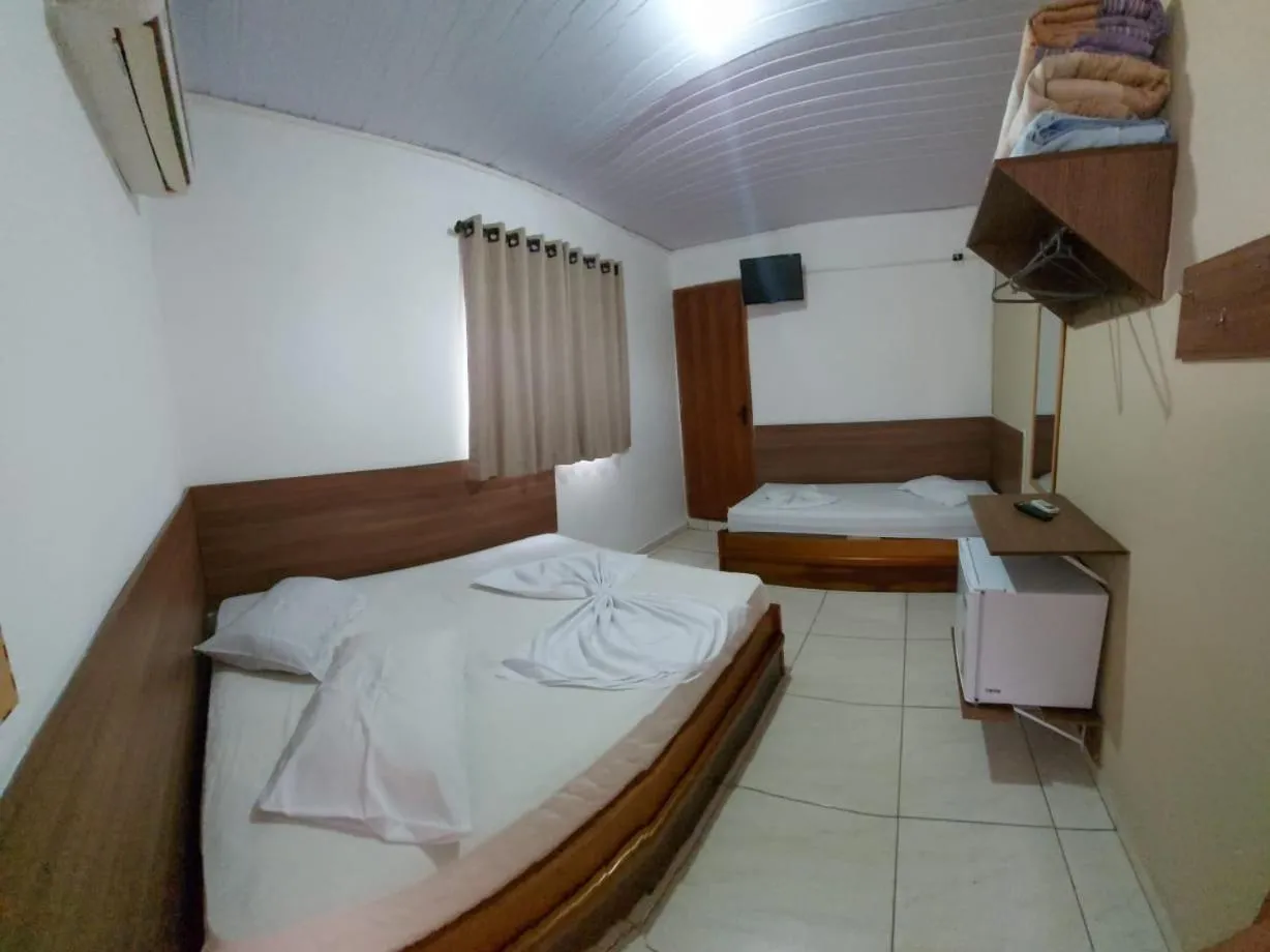 Bed in Pousada Santa Terezinha