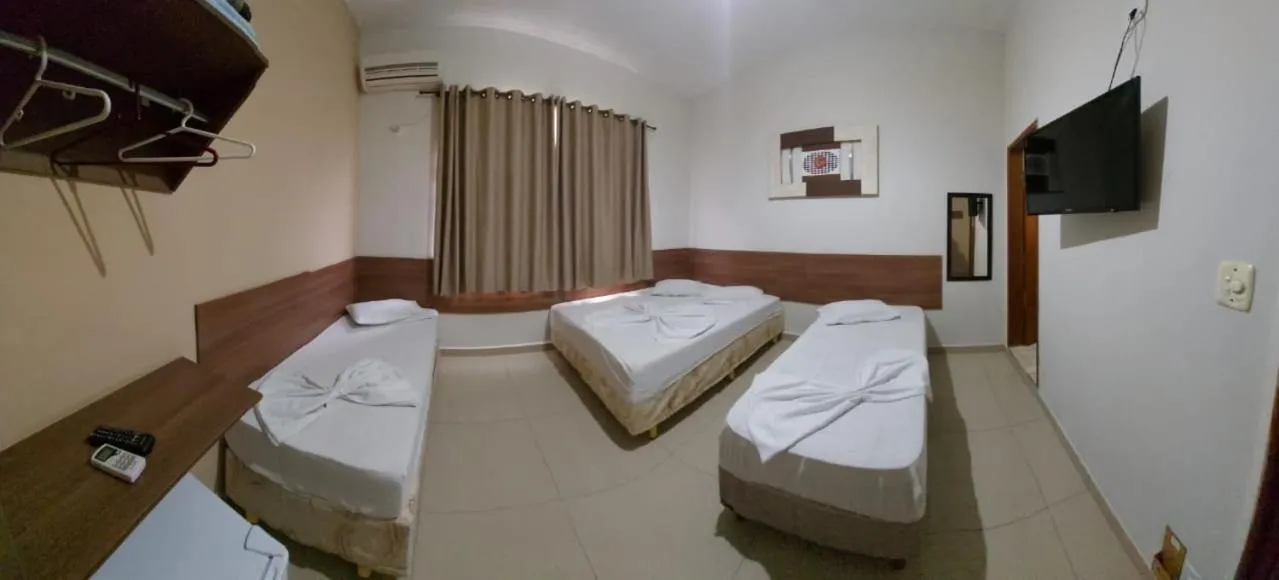 Bed in Pousada Santa Terezinha