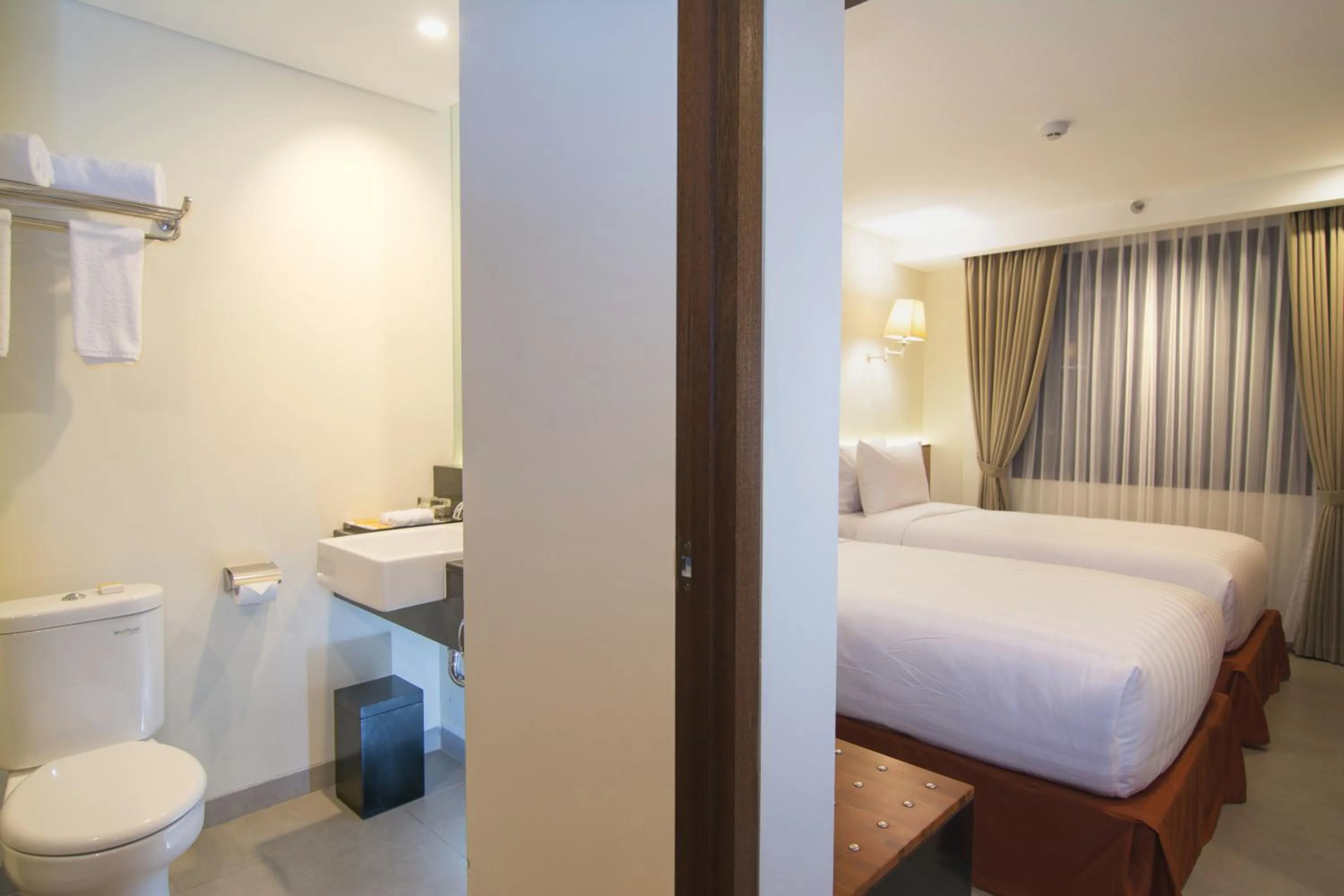Photo of the whole room, Bed in Savvoya Hotel Seminyak