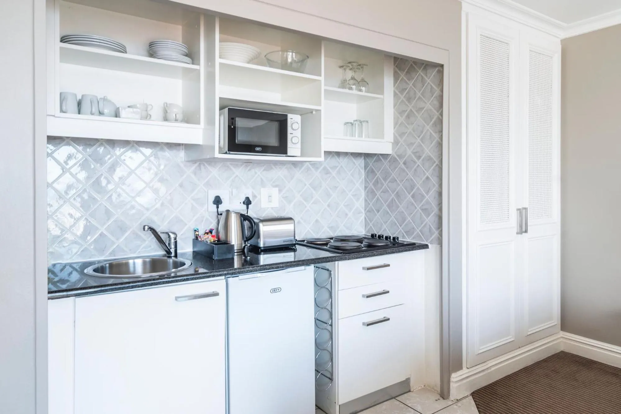 Kitchen or kitchenette in The Bantry Aparthotel by Totalstay