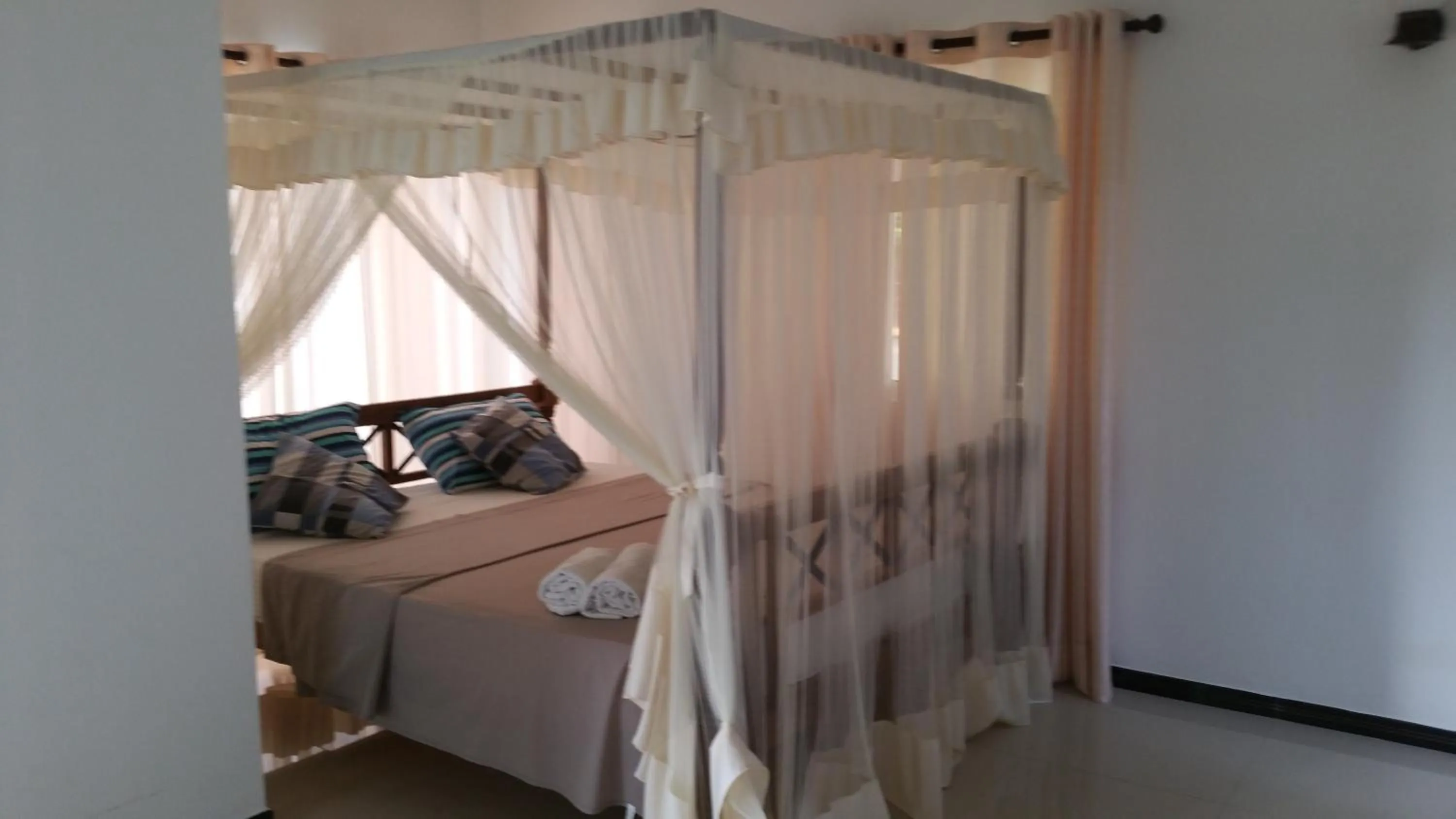 Bedroom, Bed in Coral Palm Villa and Apartment