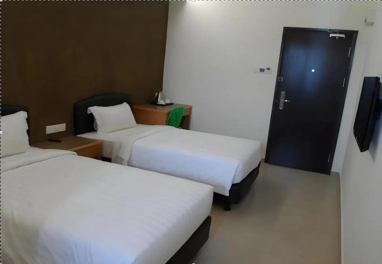 Bed in Hotel Grand Court Inn