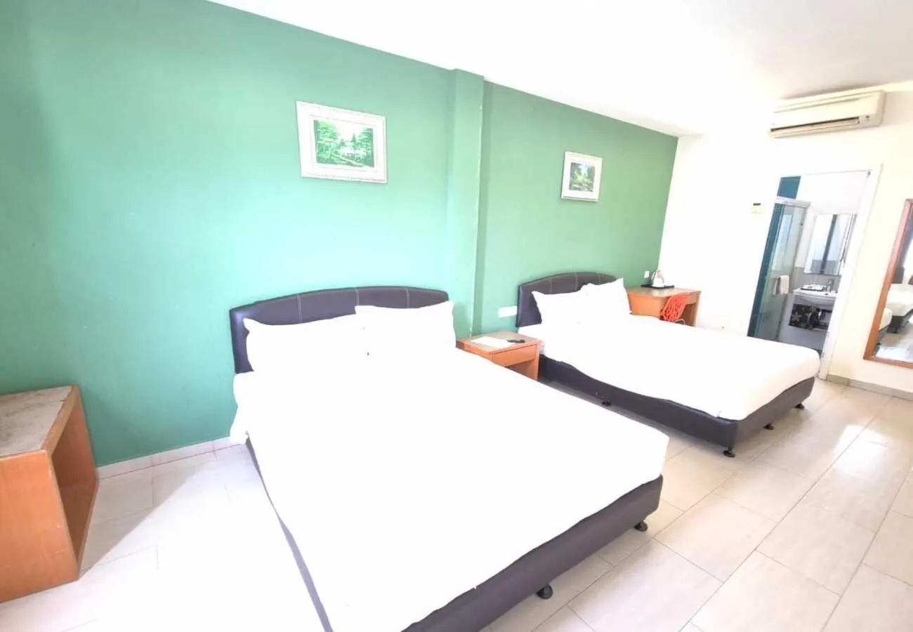 Bed in Hotel Grand Court Inn