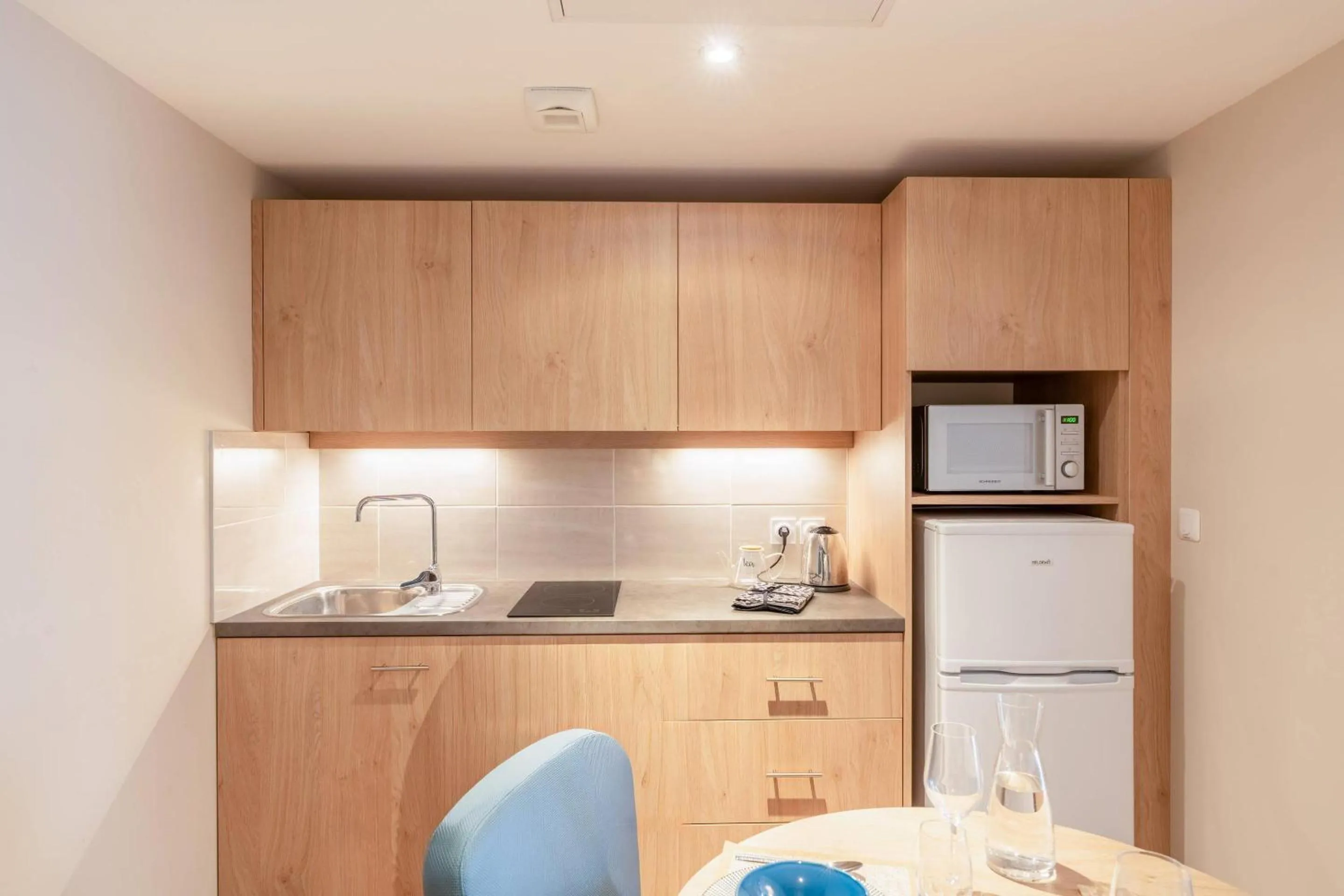 Kitchen or kitchenette in Quality Aparthotel Toulouse Ponts Jumeaux