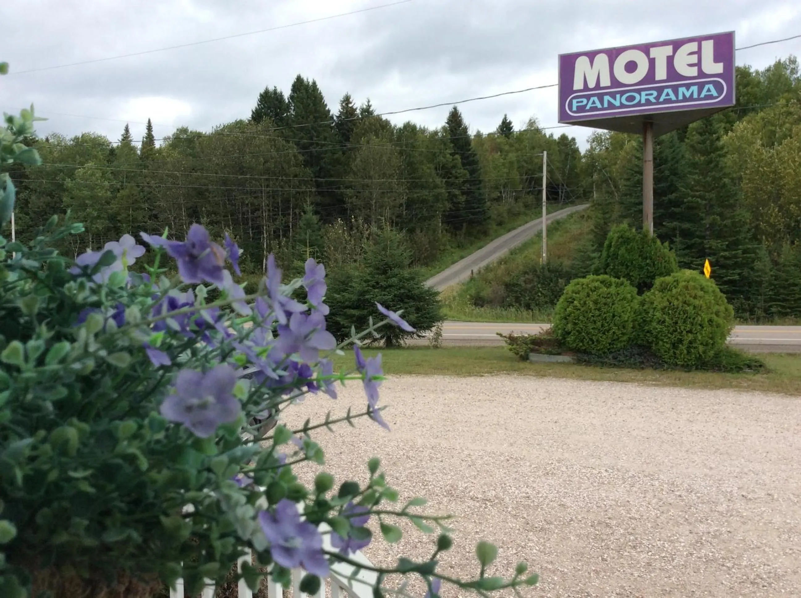 Property logo or sign in Auberge Motel Panorama