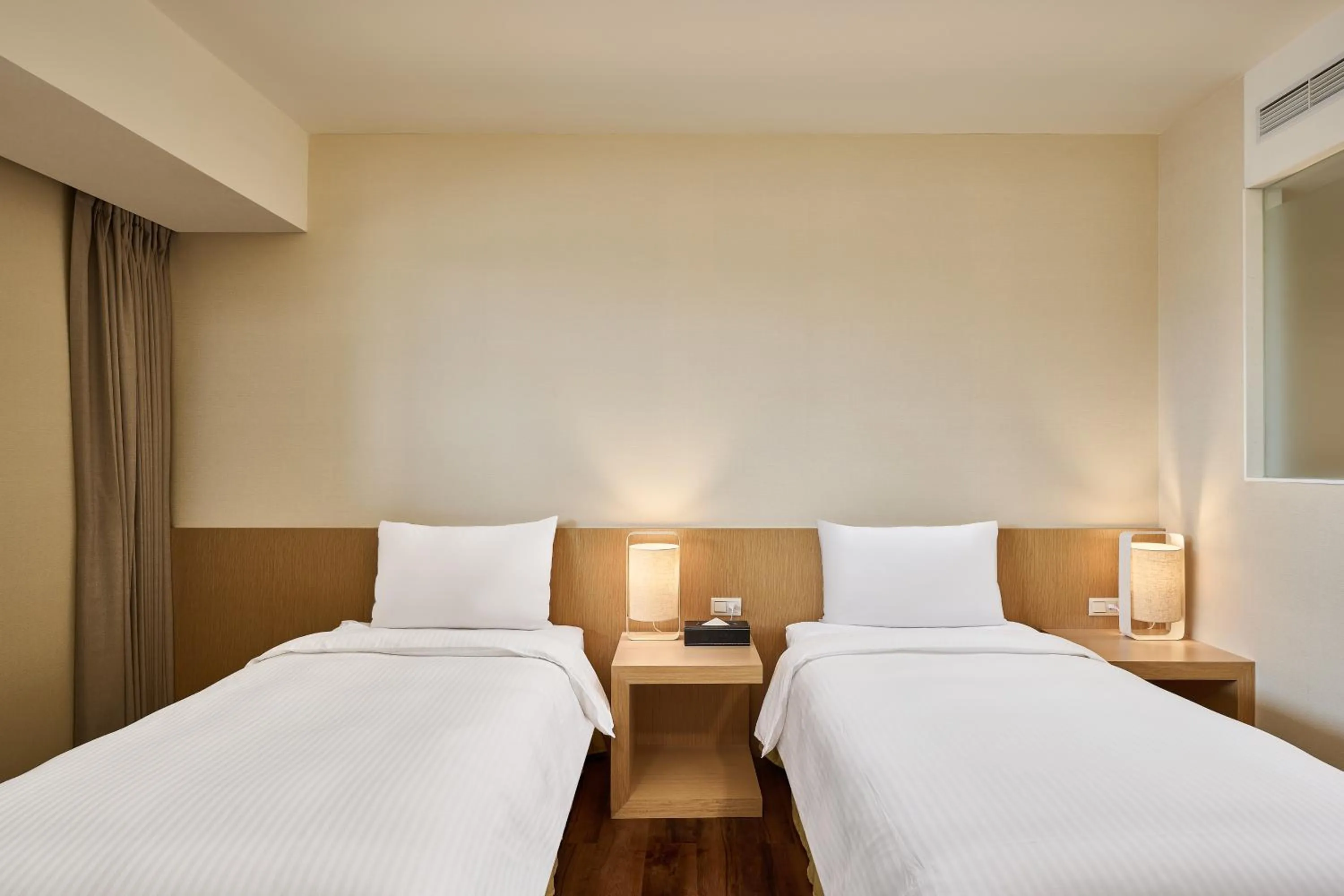 Bed in Eastin Taipei Hotel