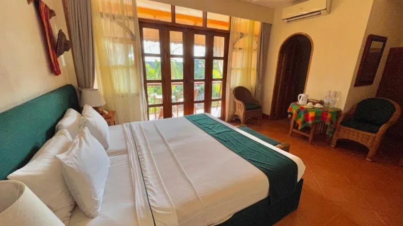 Bed in Coco Grove Beach Resort, Siquijor Island