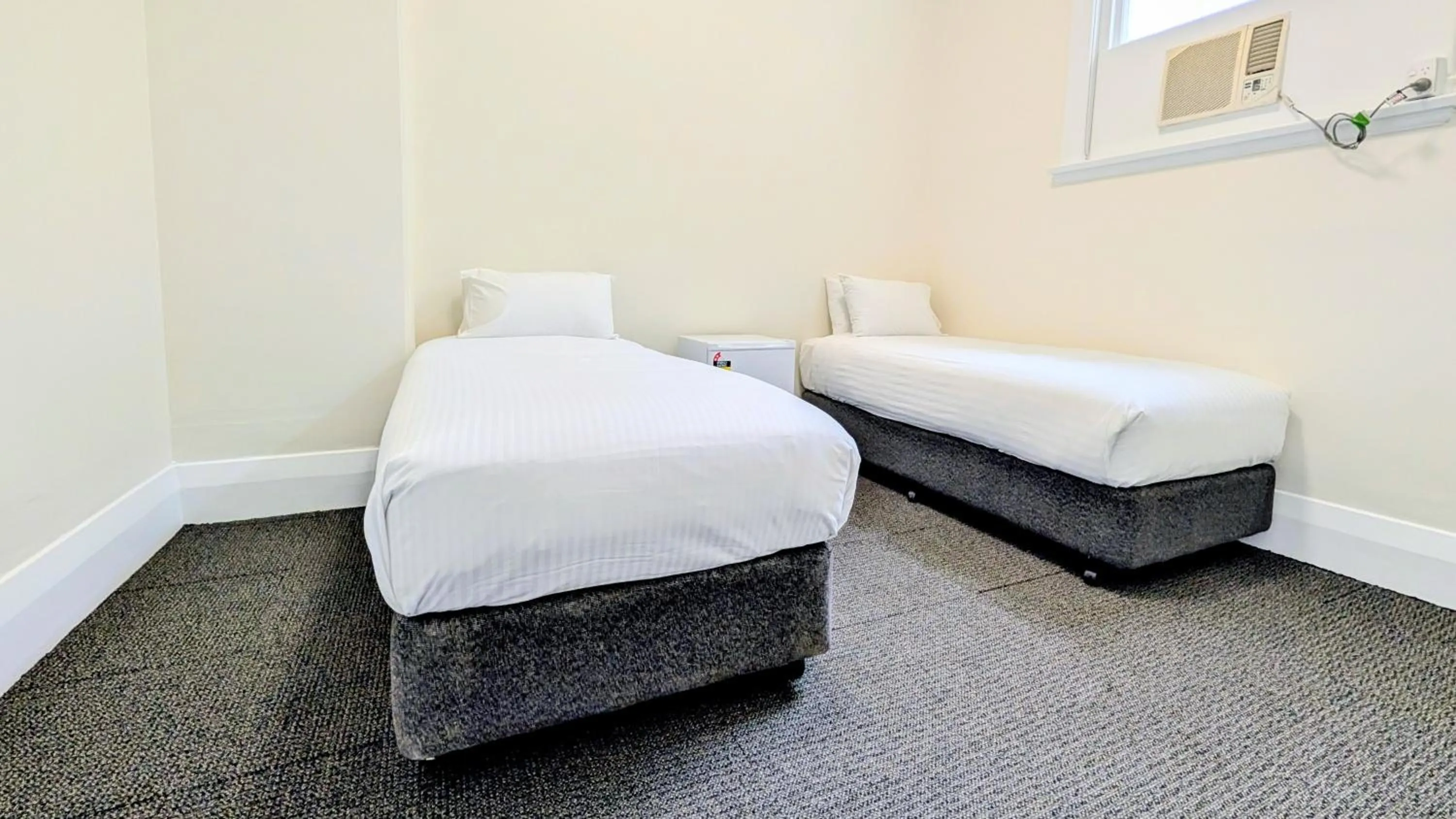 Bed in Ambassadors Hotel