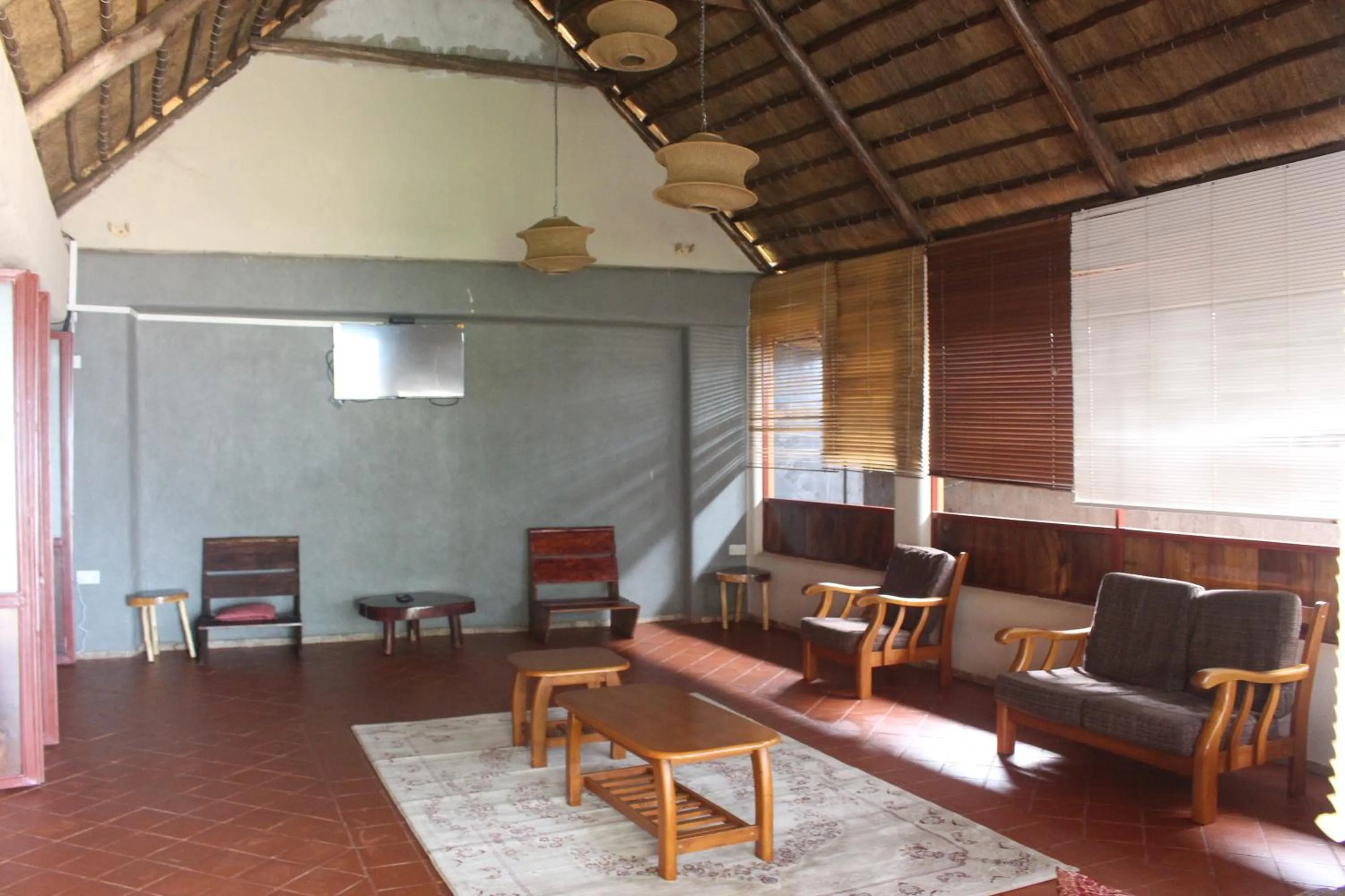 Communal lounge/ TV room in Montane Safaris Hotel, Entebbe