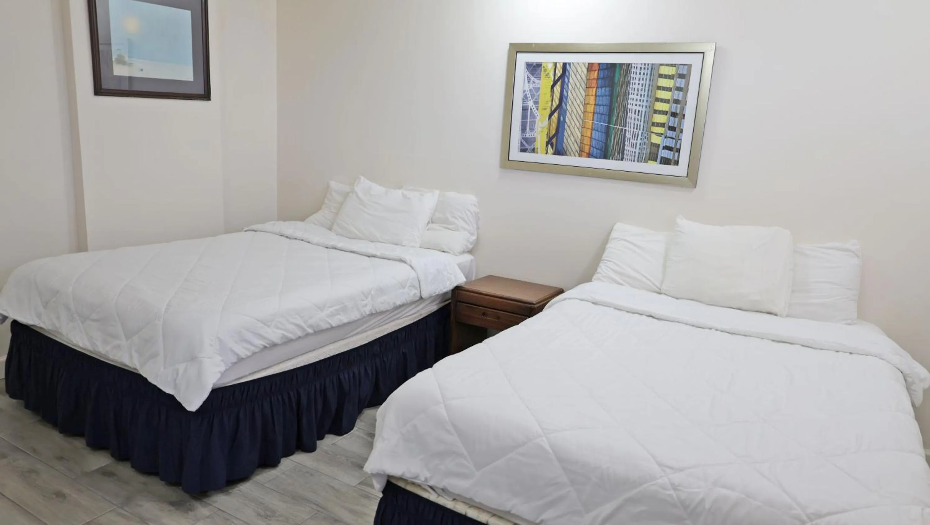 Bed in Sawmill Lodges Motel