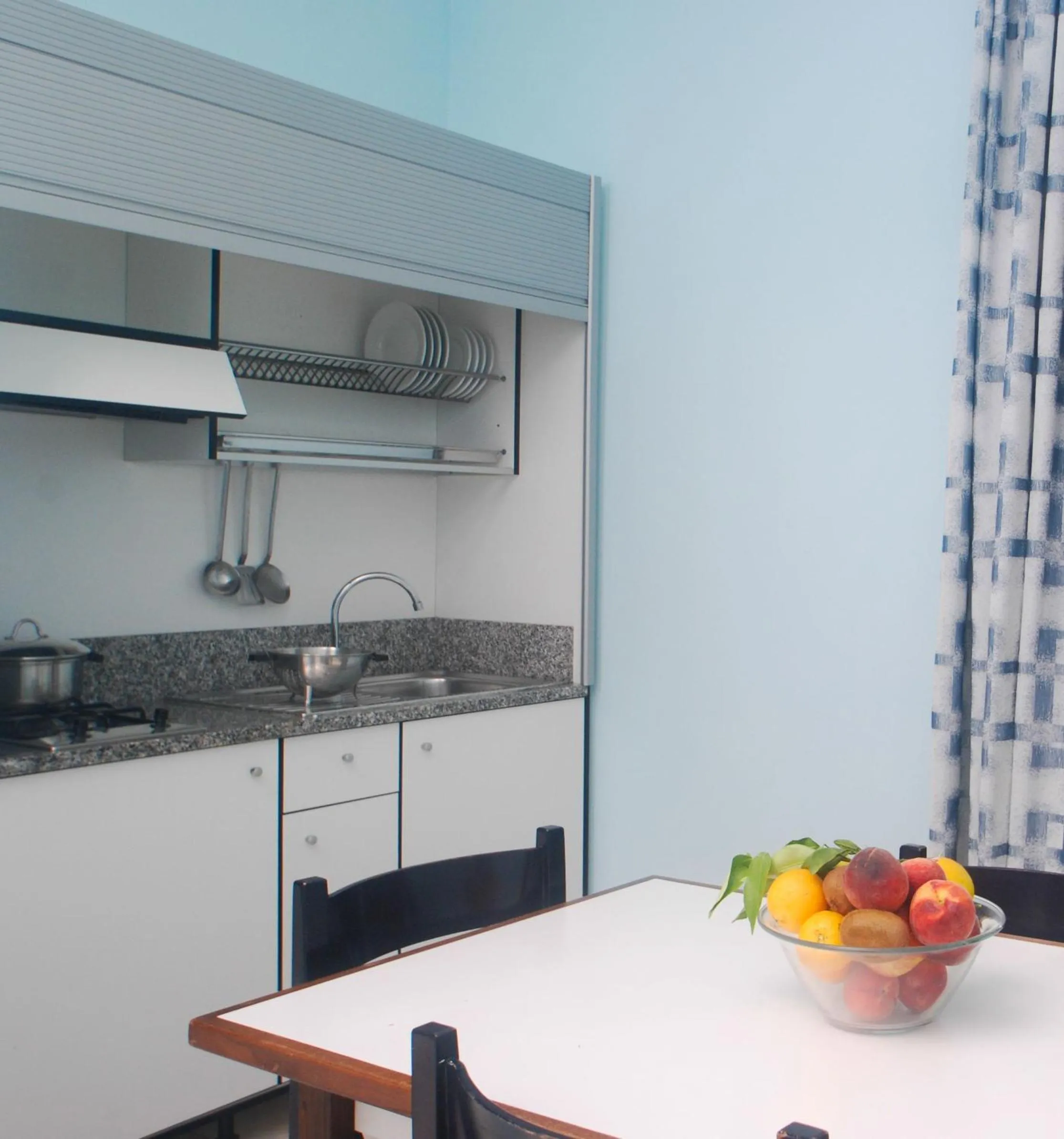 Kitchen or kitchenette in Villaggio Turistico La Mantinera - Residence