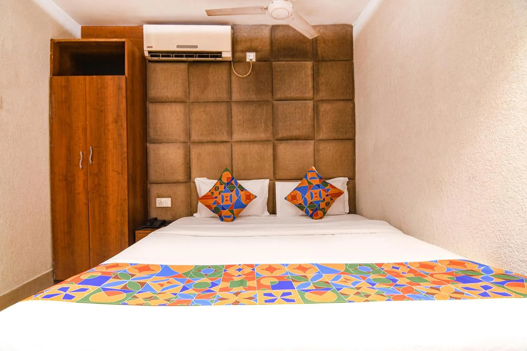 Bed in FabHotel Marina