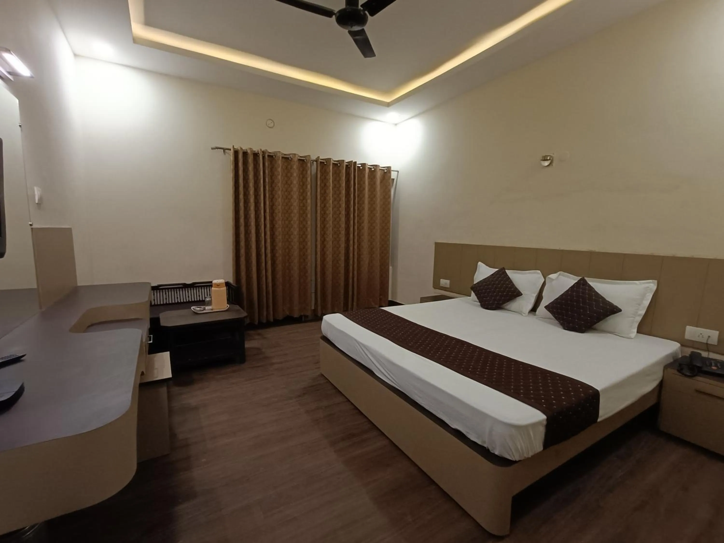 Bed in Hotel Padmini International- Sigra