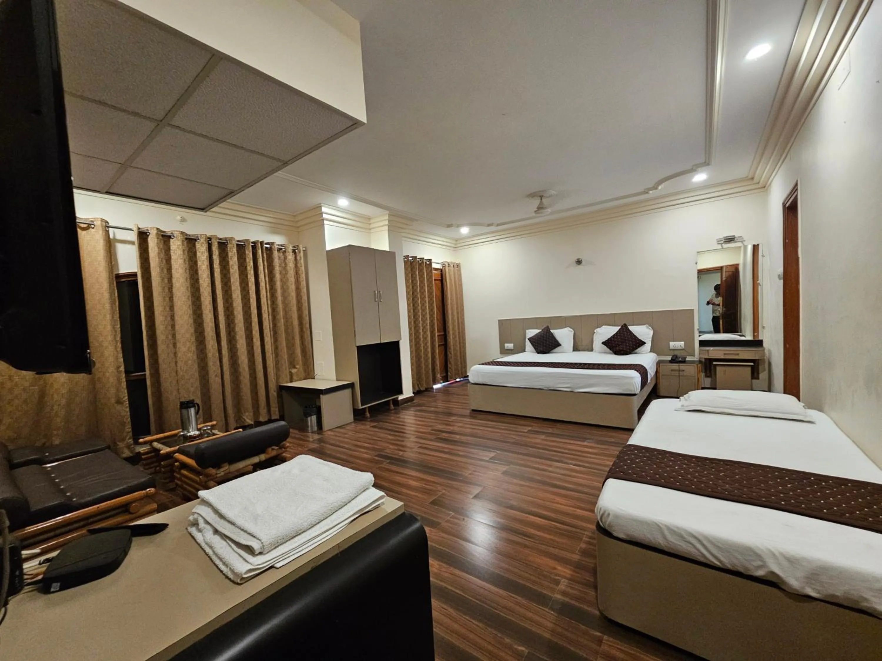 Bed in Hotel Padmini International- Sigra