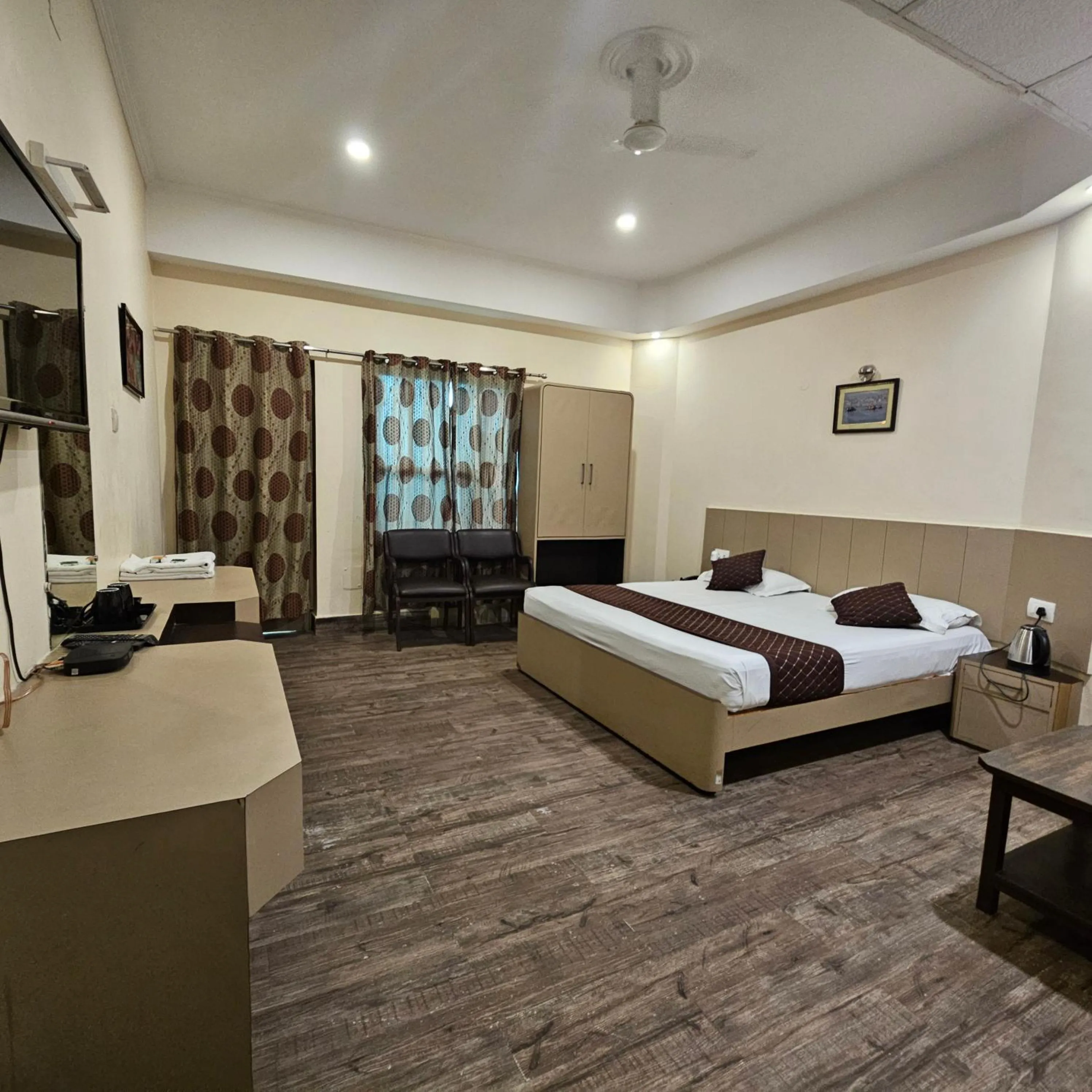 Bed in Hotel Padmini International- Sigra