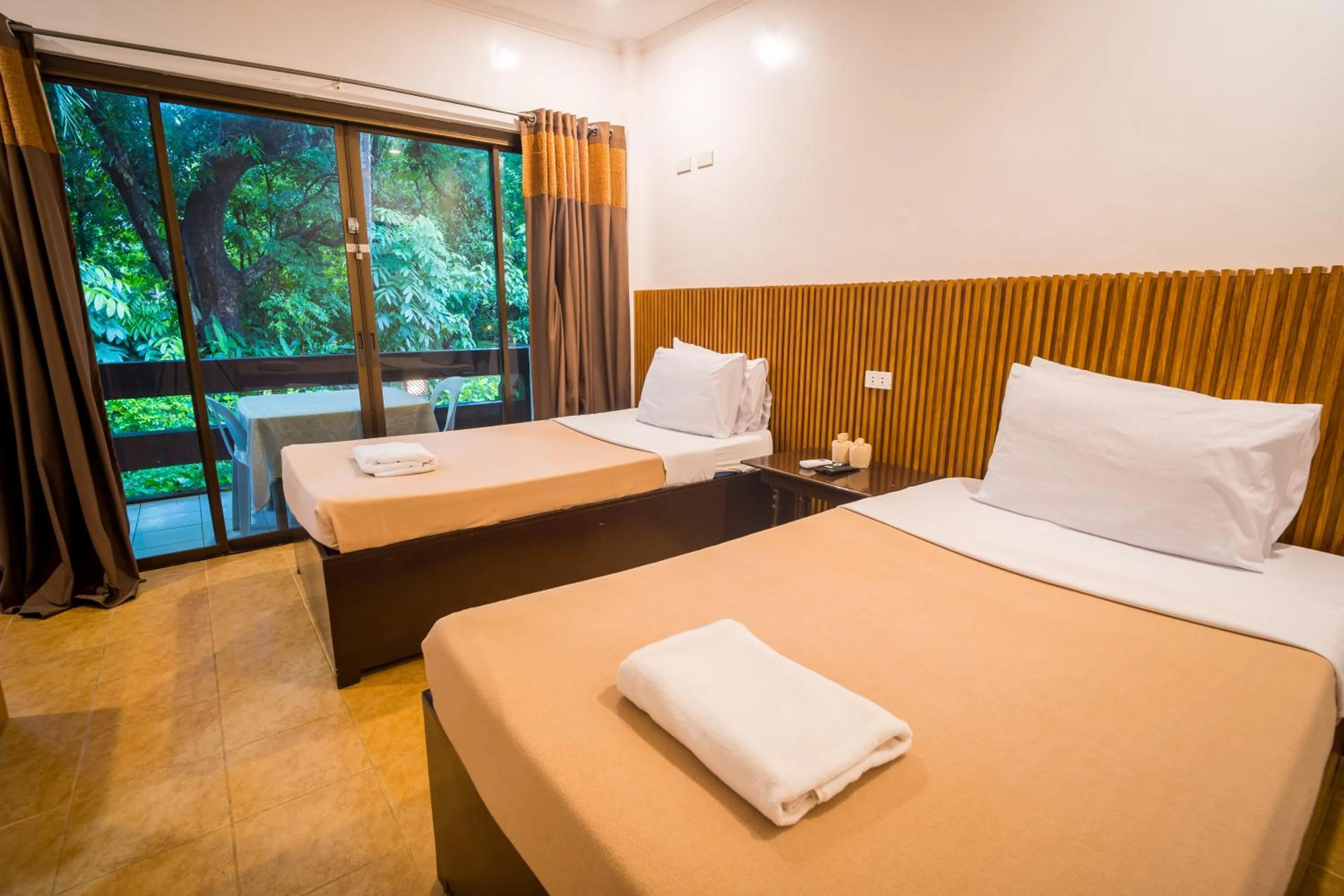 Bed in Lisland Rainforest Resort