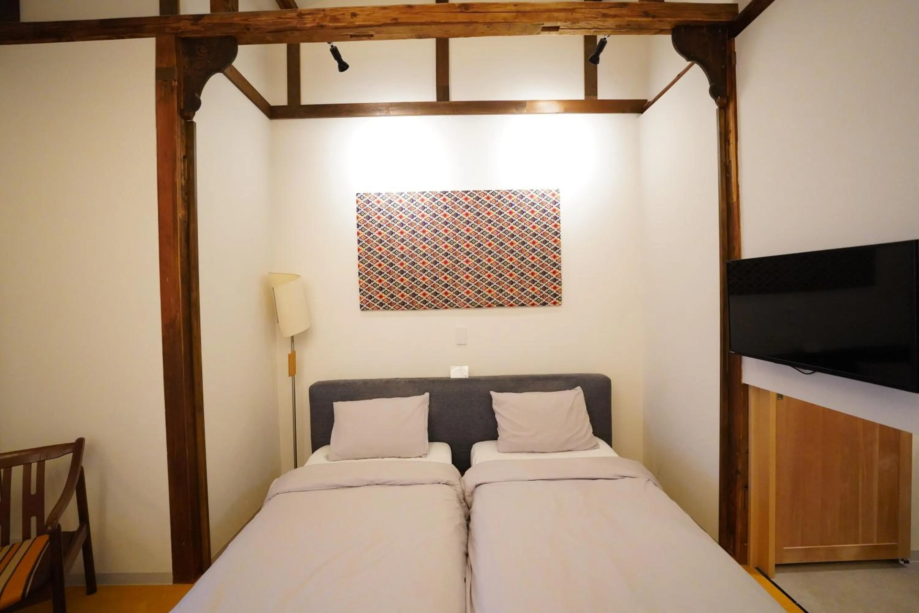 Bed in Traditional Apartment Takamatsu Guesthouse