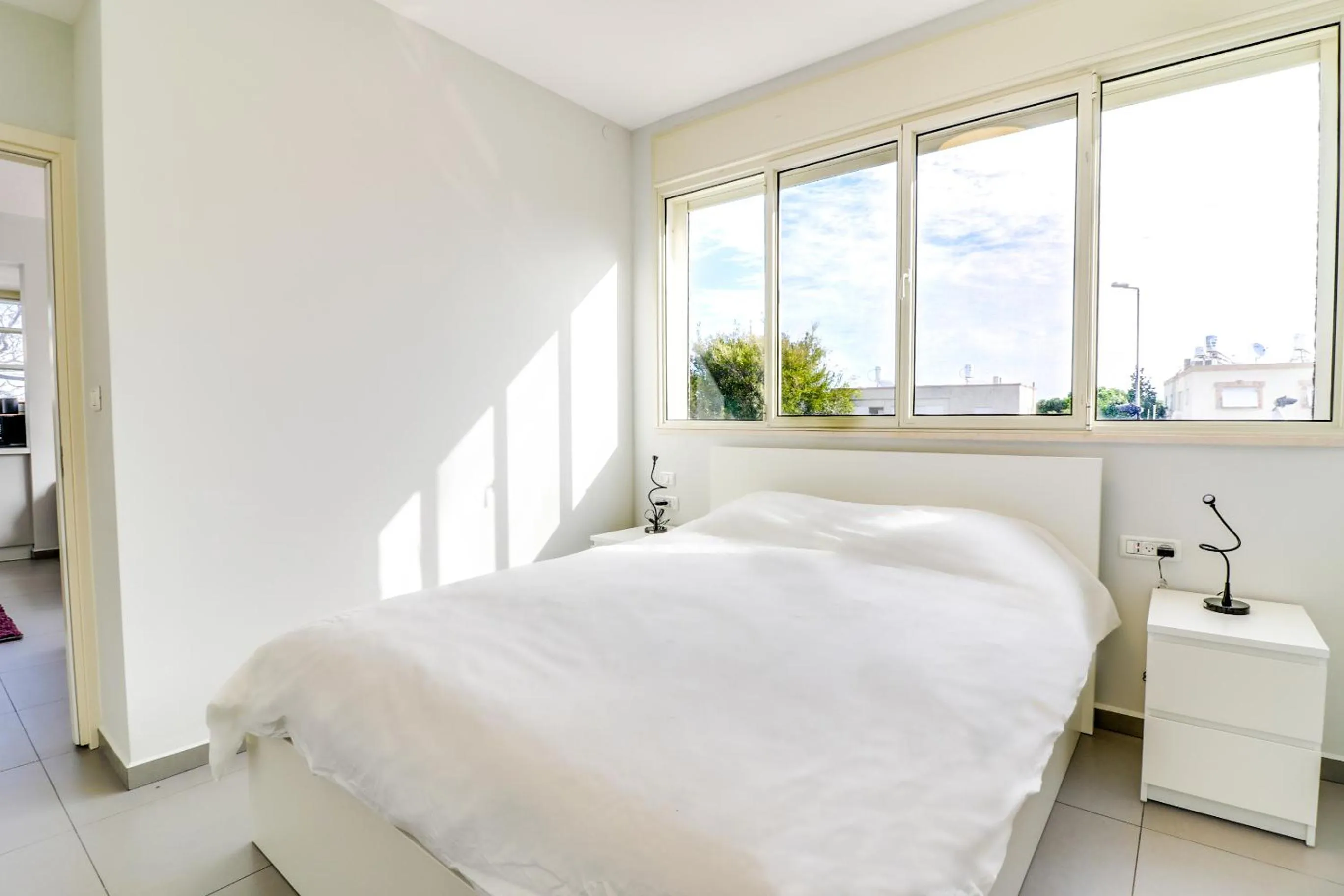 Bed in Carmel Boutique Apartments