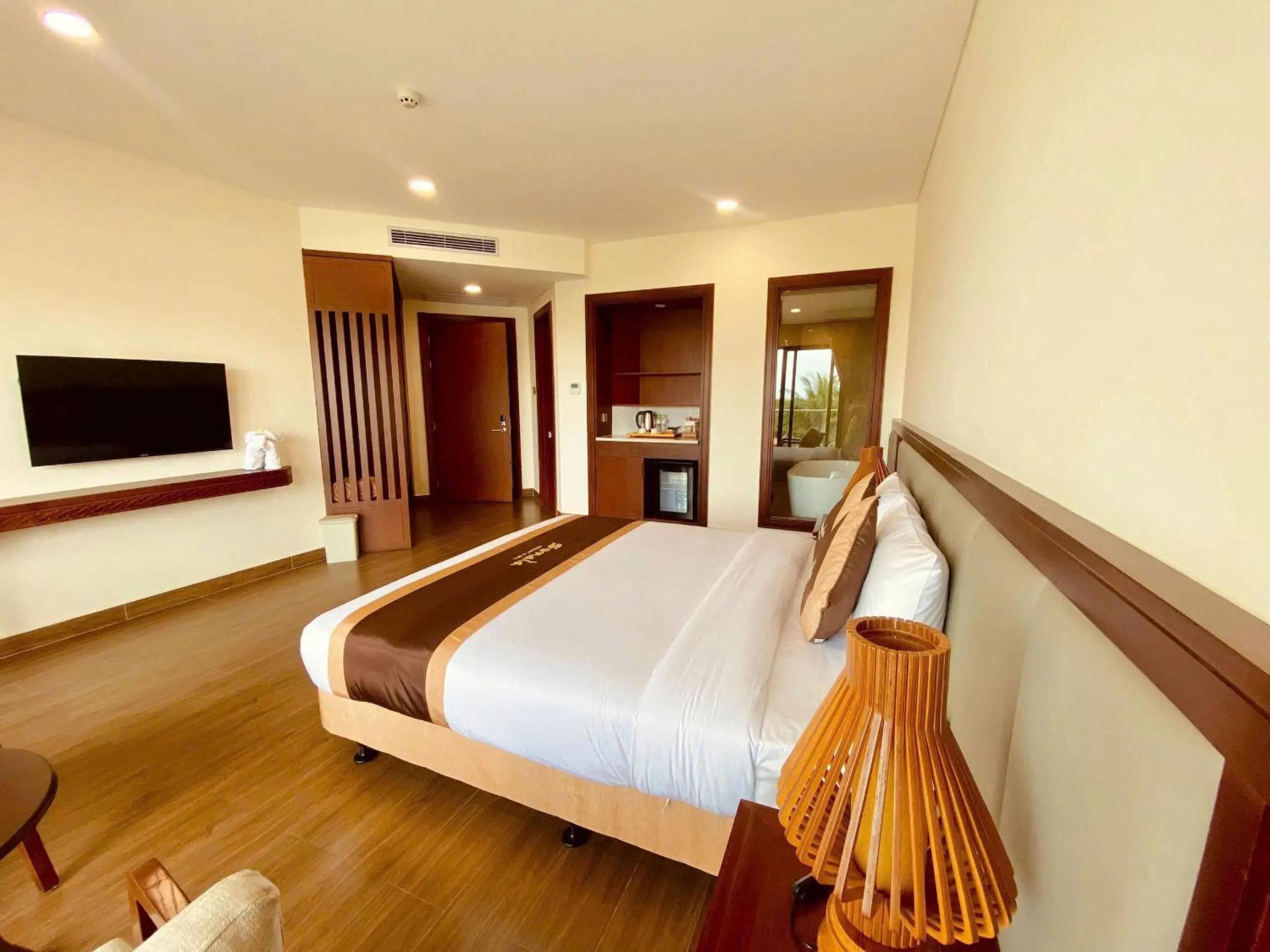 Bed in Sonata Resort & Spa