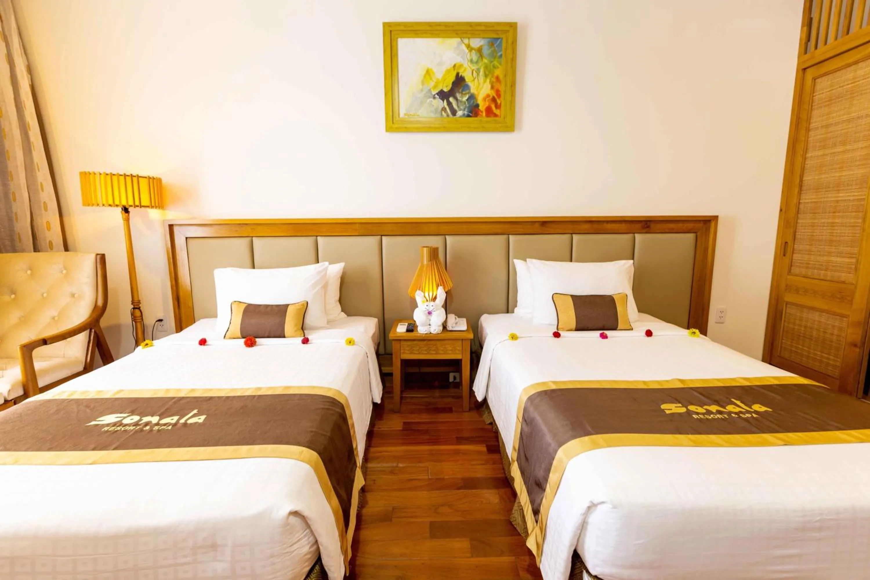 Bed in Sonata Resort & Spa