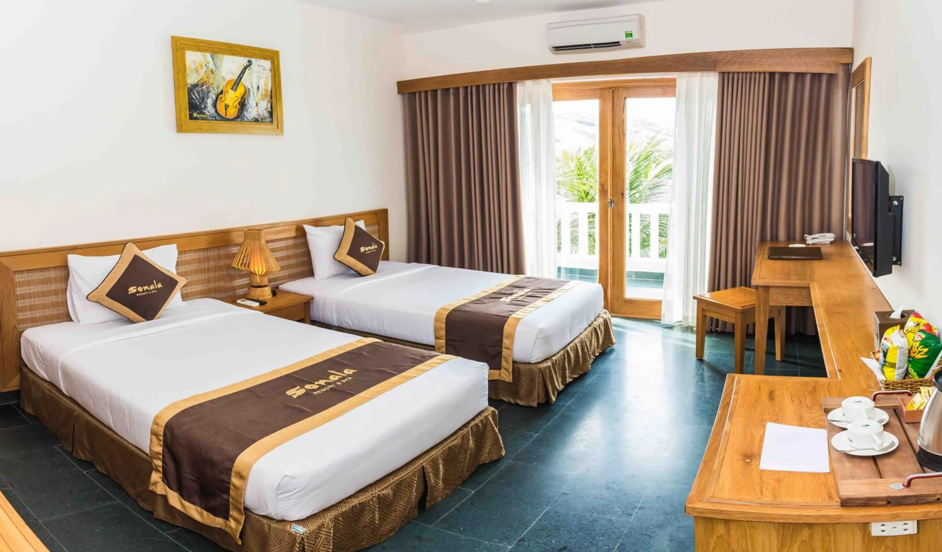 Bed in Sonata Resort & Spa