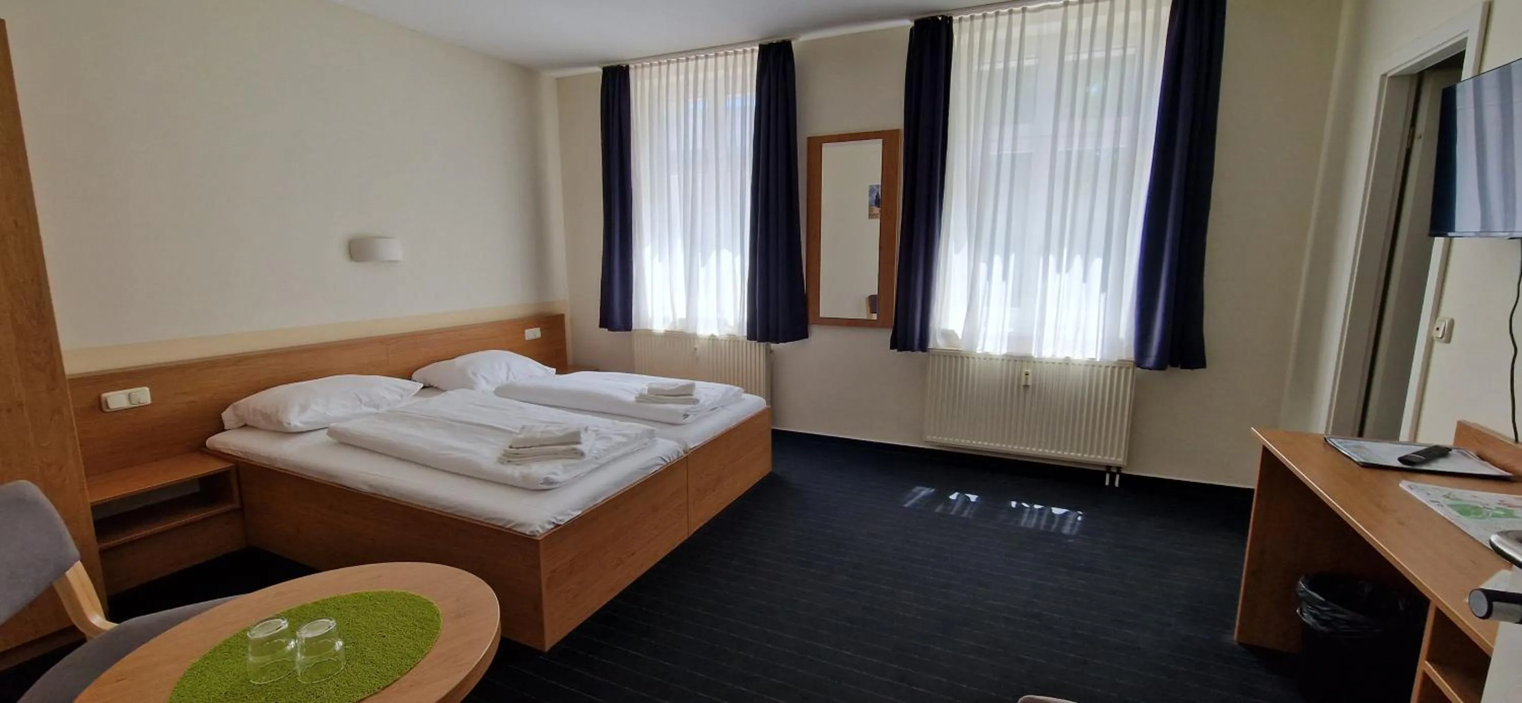 Photo of the whole room, Bed in City-Pension Magdeburg