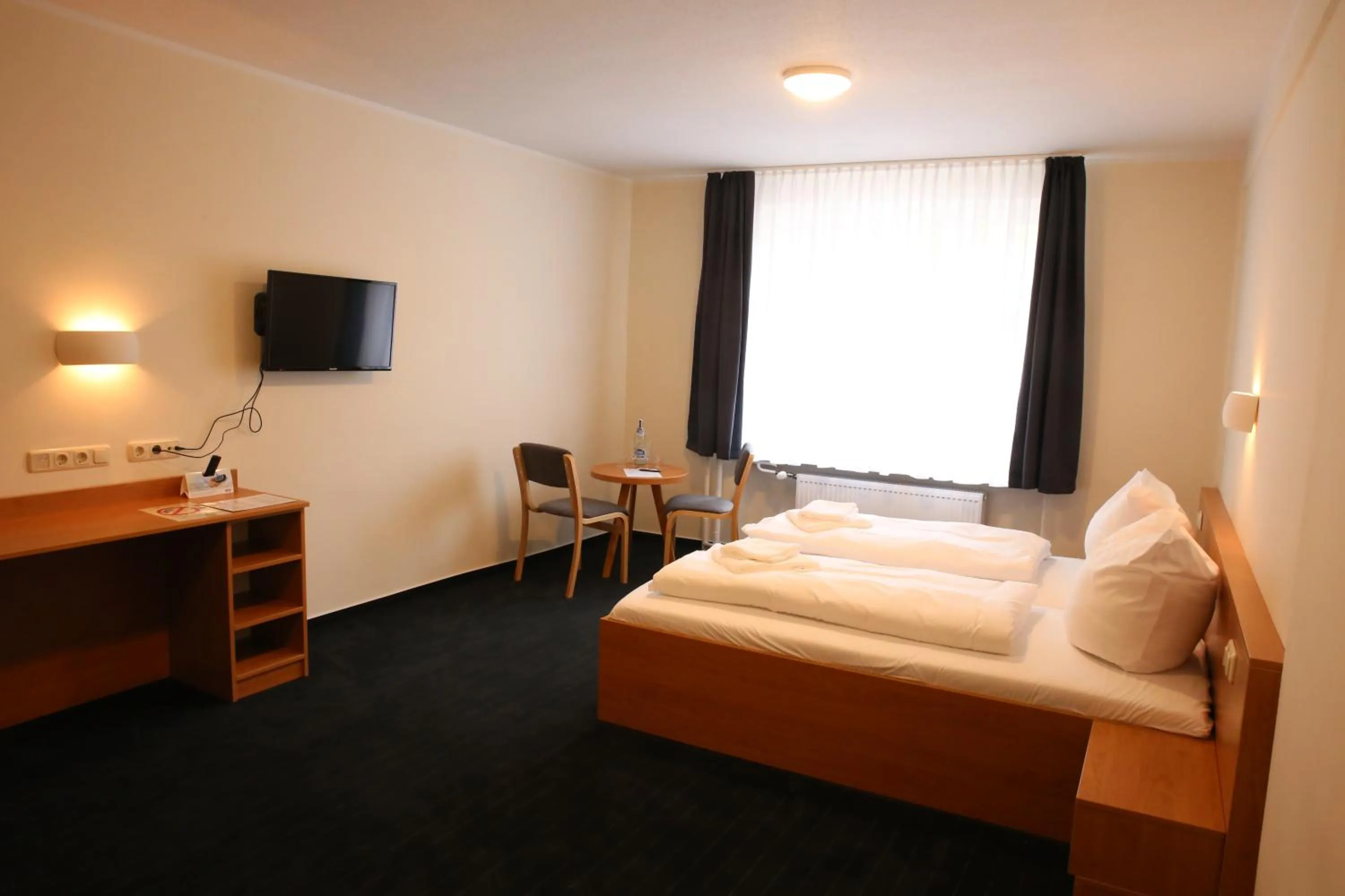 Photo of the whole room, Bed in City-Pension Magdeburg