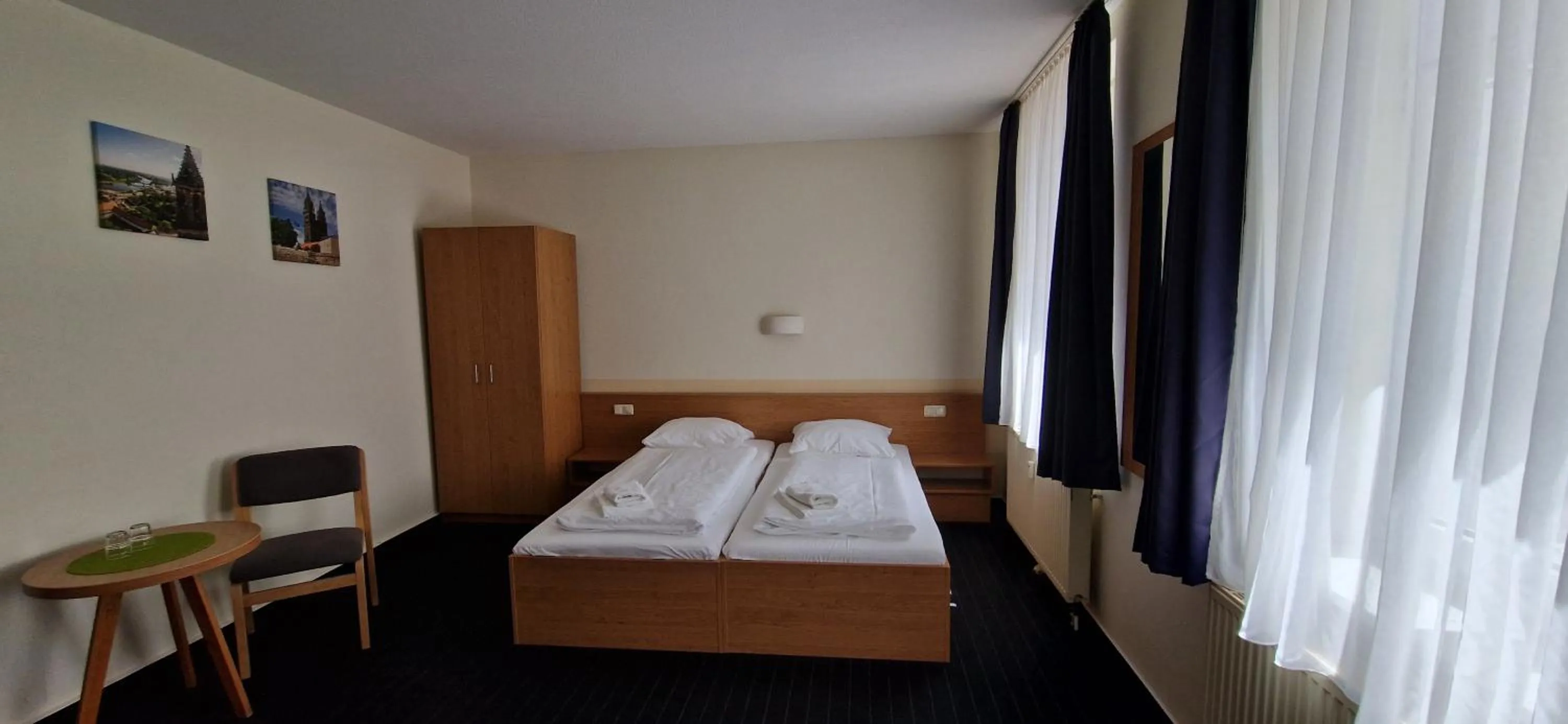 Photo of the whole room, Bed in City-Pension Magdeburg