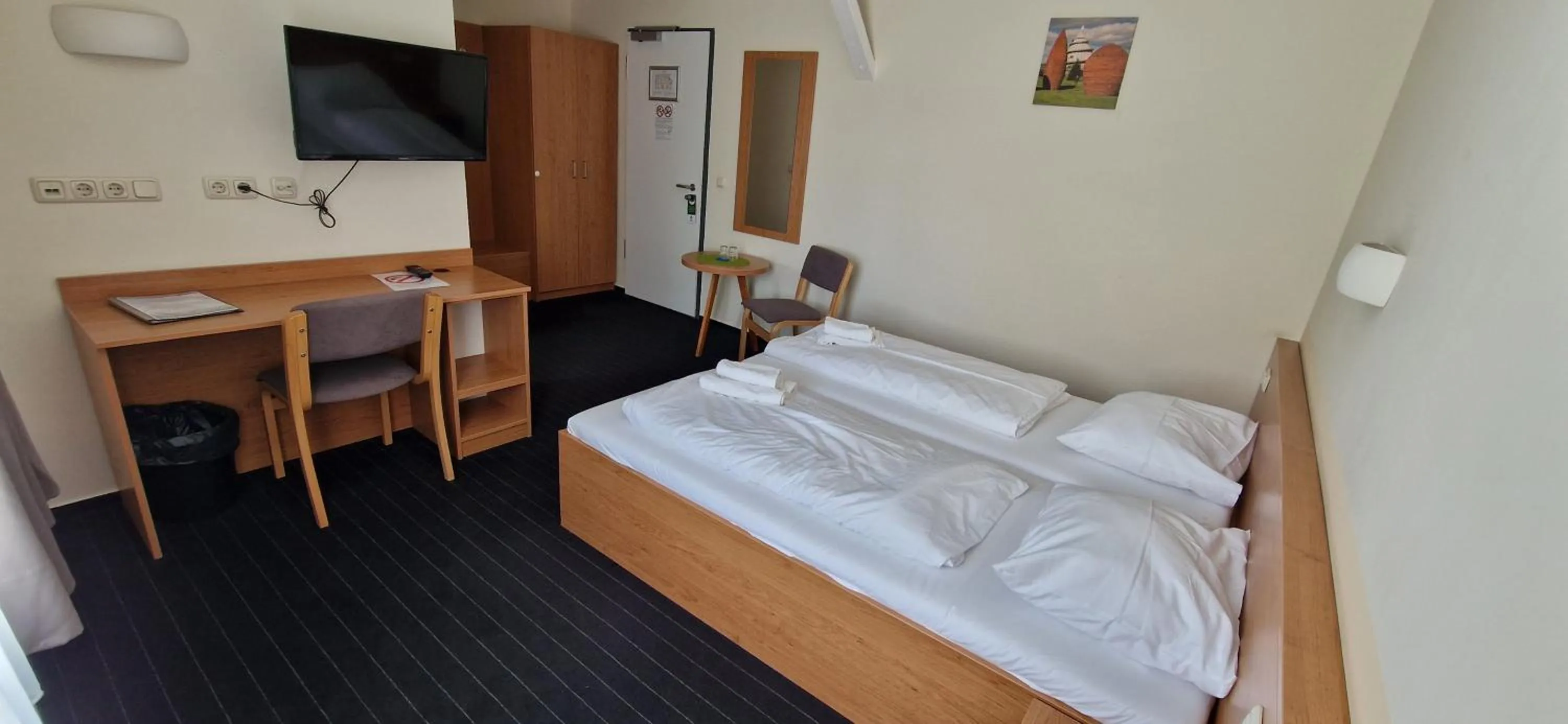 Photo of the whole room, Bed in City-Pension Magdeburg