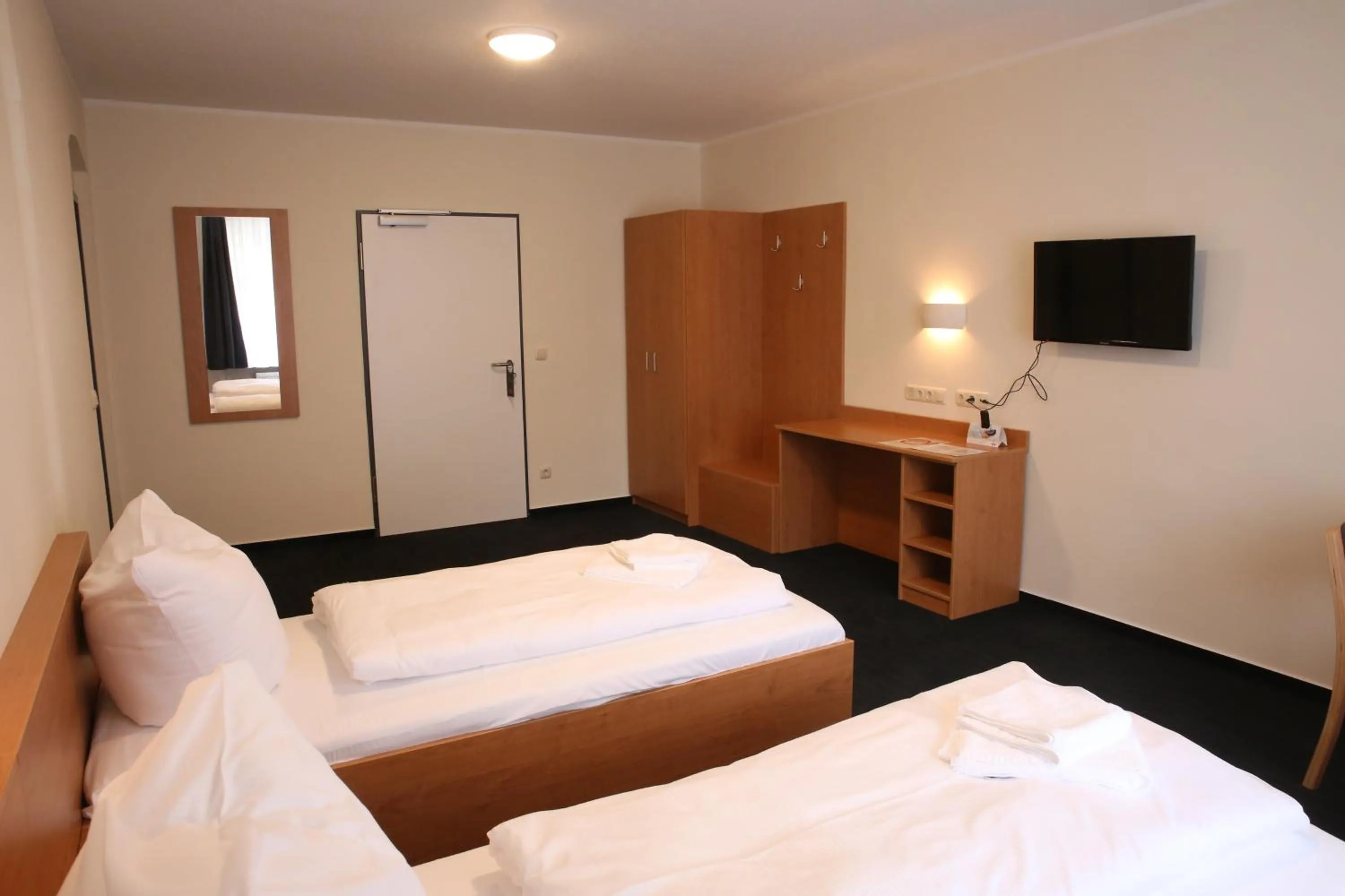 Photo of the whole room, Bed in City-Pension Magdeburg
